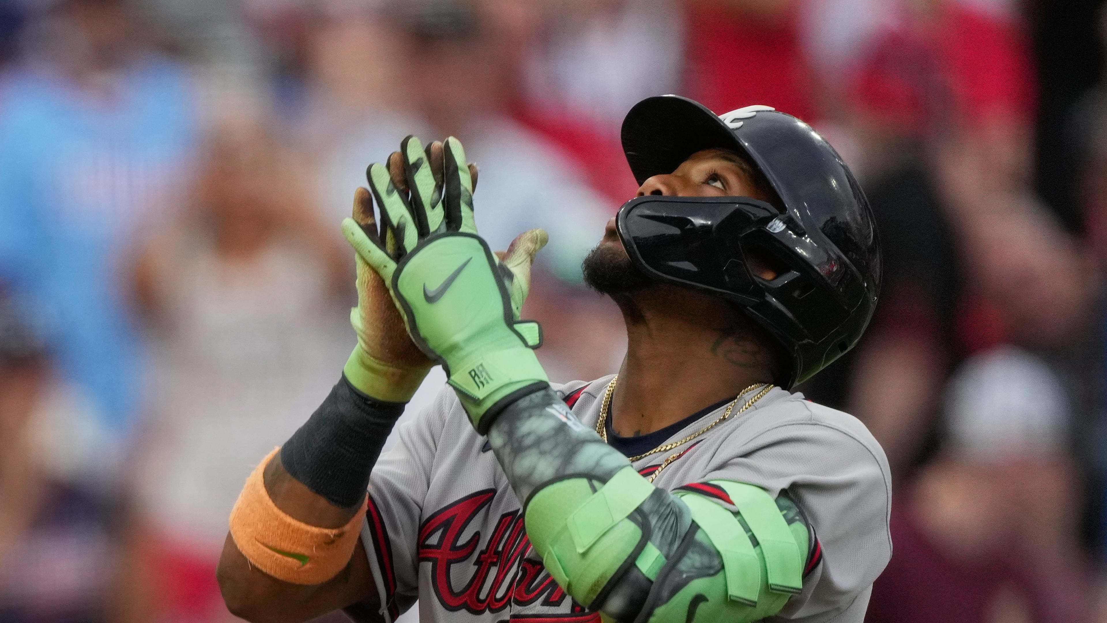 Atlanta Braves right fielder Ronald Acuña Jr. reacts as he crosses home plate after hitting a solo home run during the third inning of a baseball game against the Cincinnati Reds in Cincinnati, Saturday, May 30, 2026. (AP Photo/Carolyn Kaster)