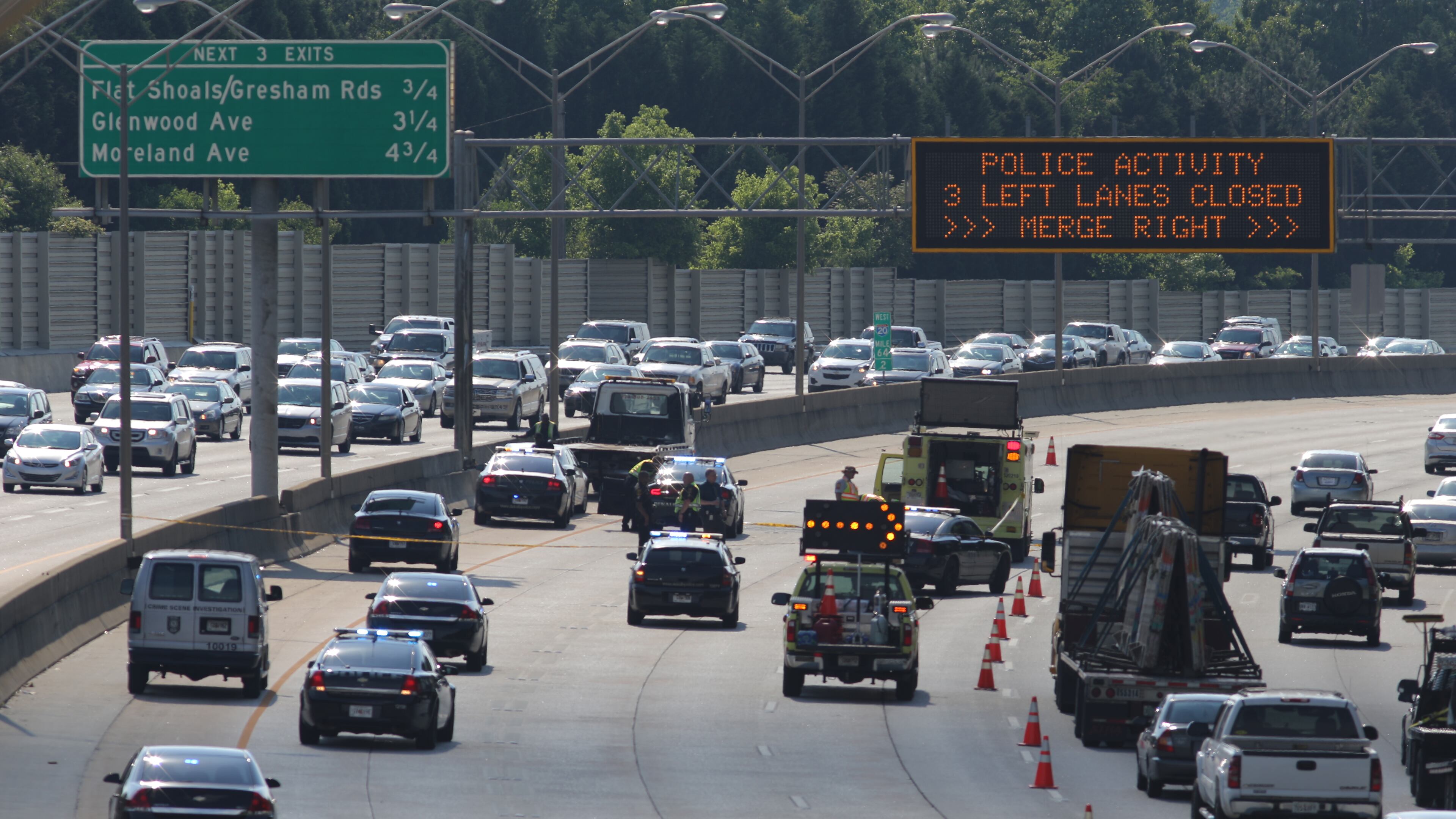 Traffic was tied up after a man shot himself on I-20 in DeKalb County on Thursday afternoon. (Ben Gray / bgray@ajc.com)