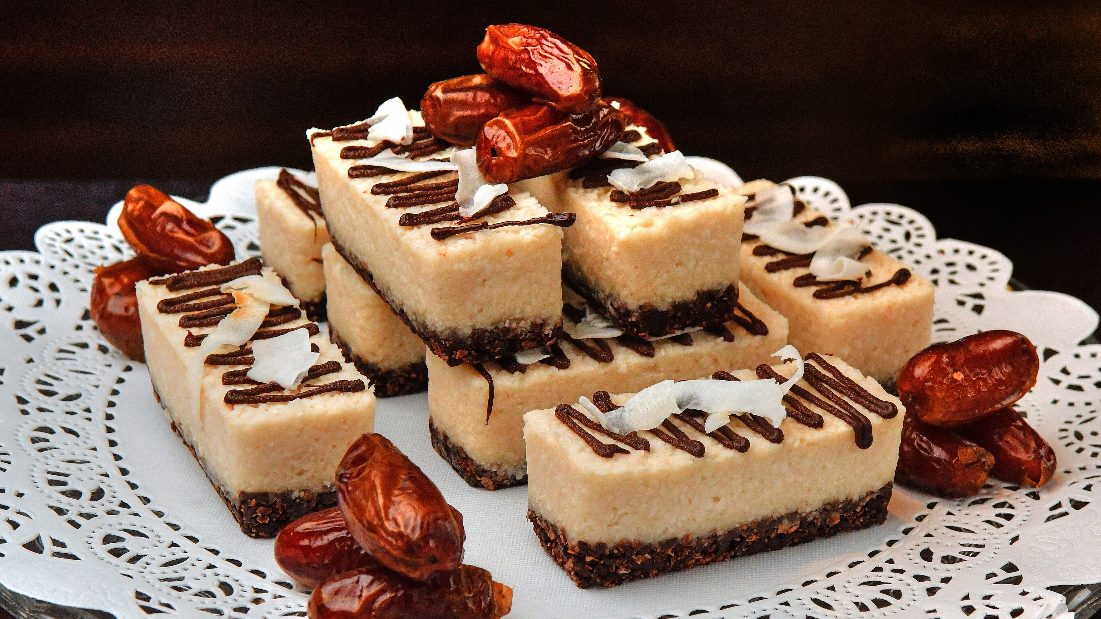 Coconut Bars (styled with dates) from Saint Germain Bakery at Ponce City Market make great use of dates in their base. (Styling by Mathieu Jourdan-Gassin / Chris Hunt for the AJC)