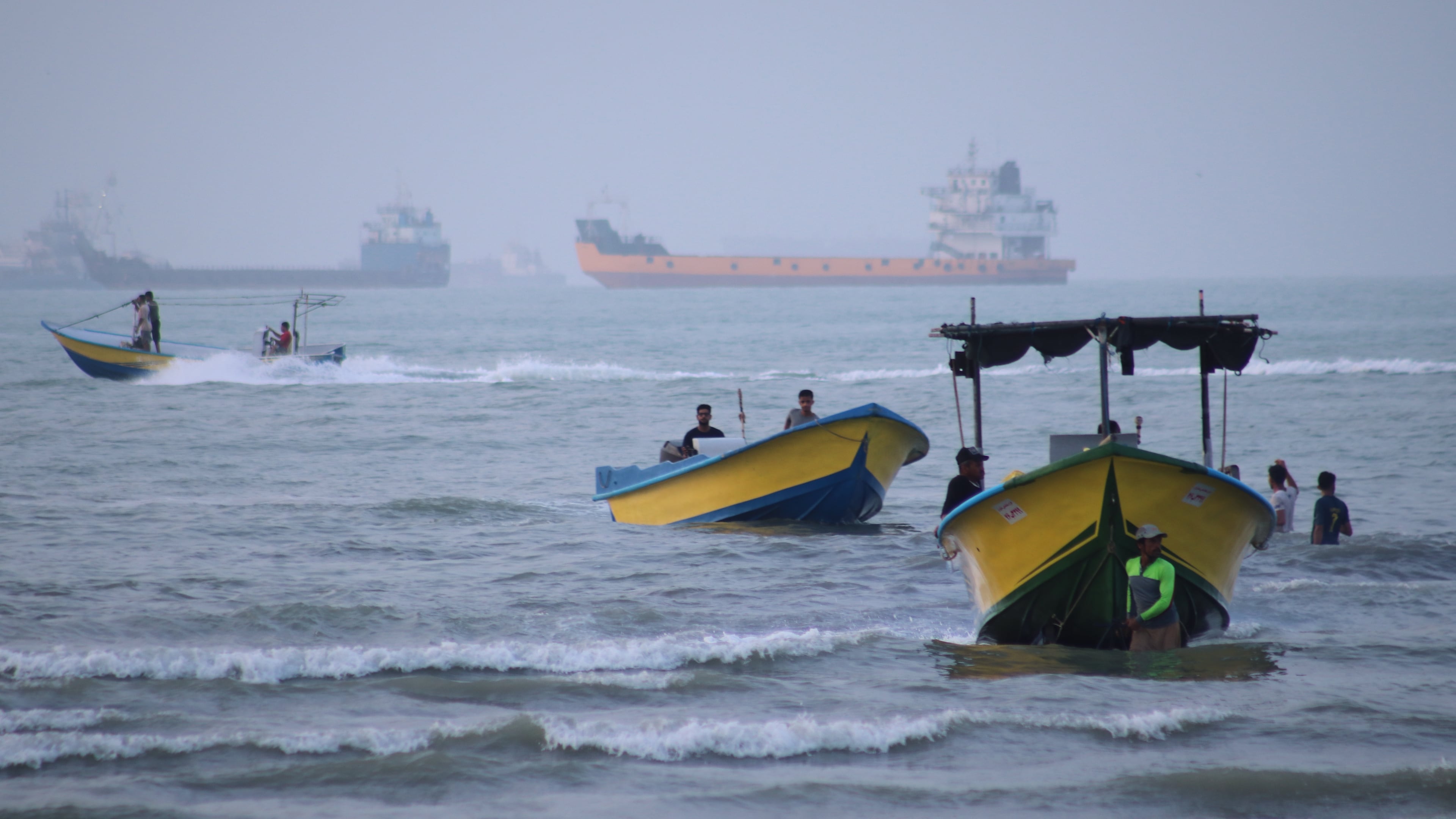 Small boats line the shore as cargo ships and other commercial vessels appear anchored in the Strait of Hormuz off Bandar Abbas, Iran, Monday, July 27, 2026. (Razieh Poudat/ISNA via AP)