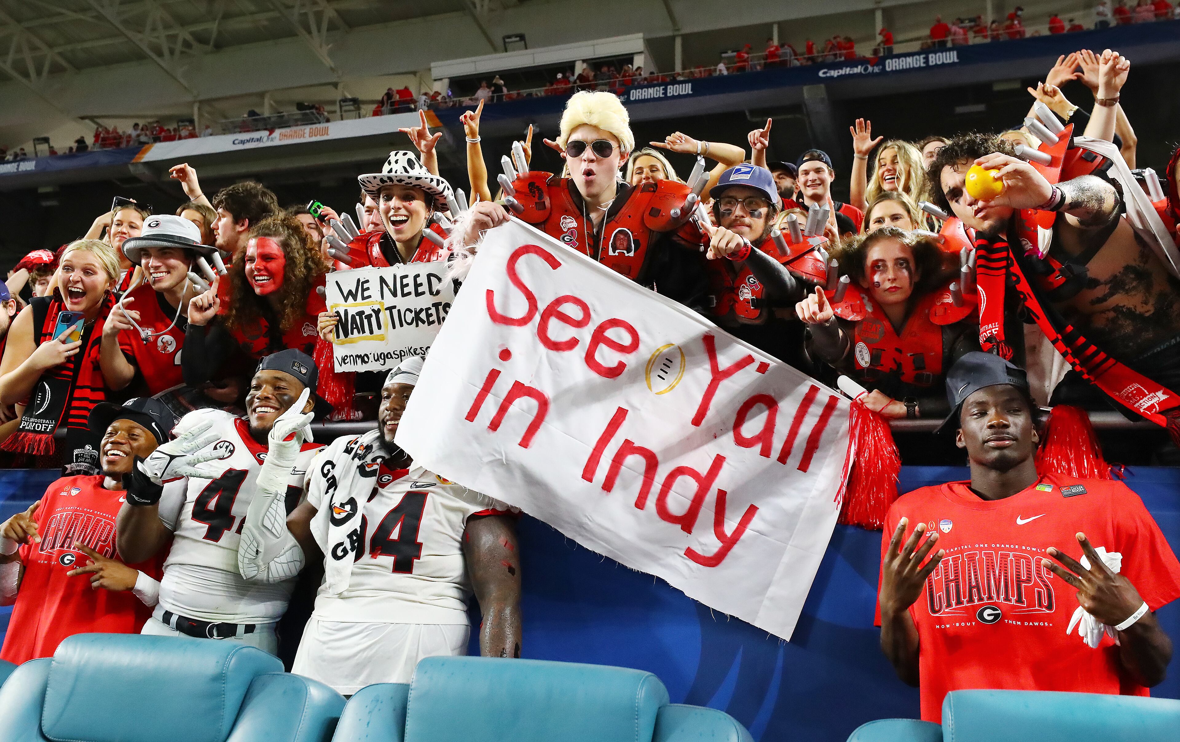 Georgia players join their fans to celebrate beating Michigan 34-11 to win the Orange Bowl at Hard Rock Stadium in Miami Gardens. Curtis Compton / Curtis.Compton@ajc.com