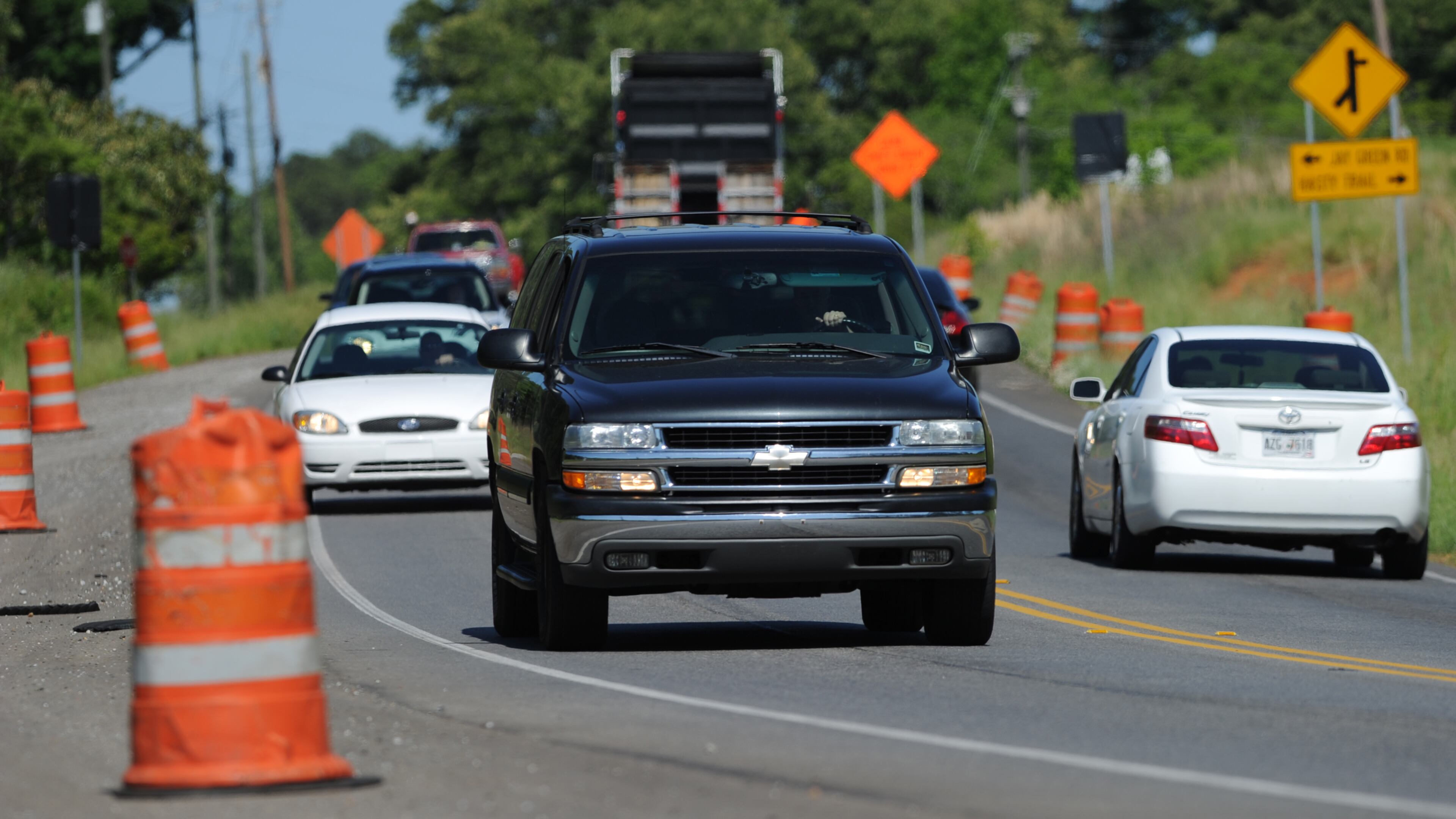 Vehicles travel up and down Georgia Highway 20 near Harmony Drive on Monday, May 5, 2013. JOHNNY CRAWFORD / JCRAWFORD@AJC.COM