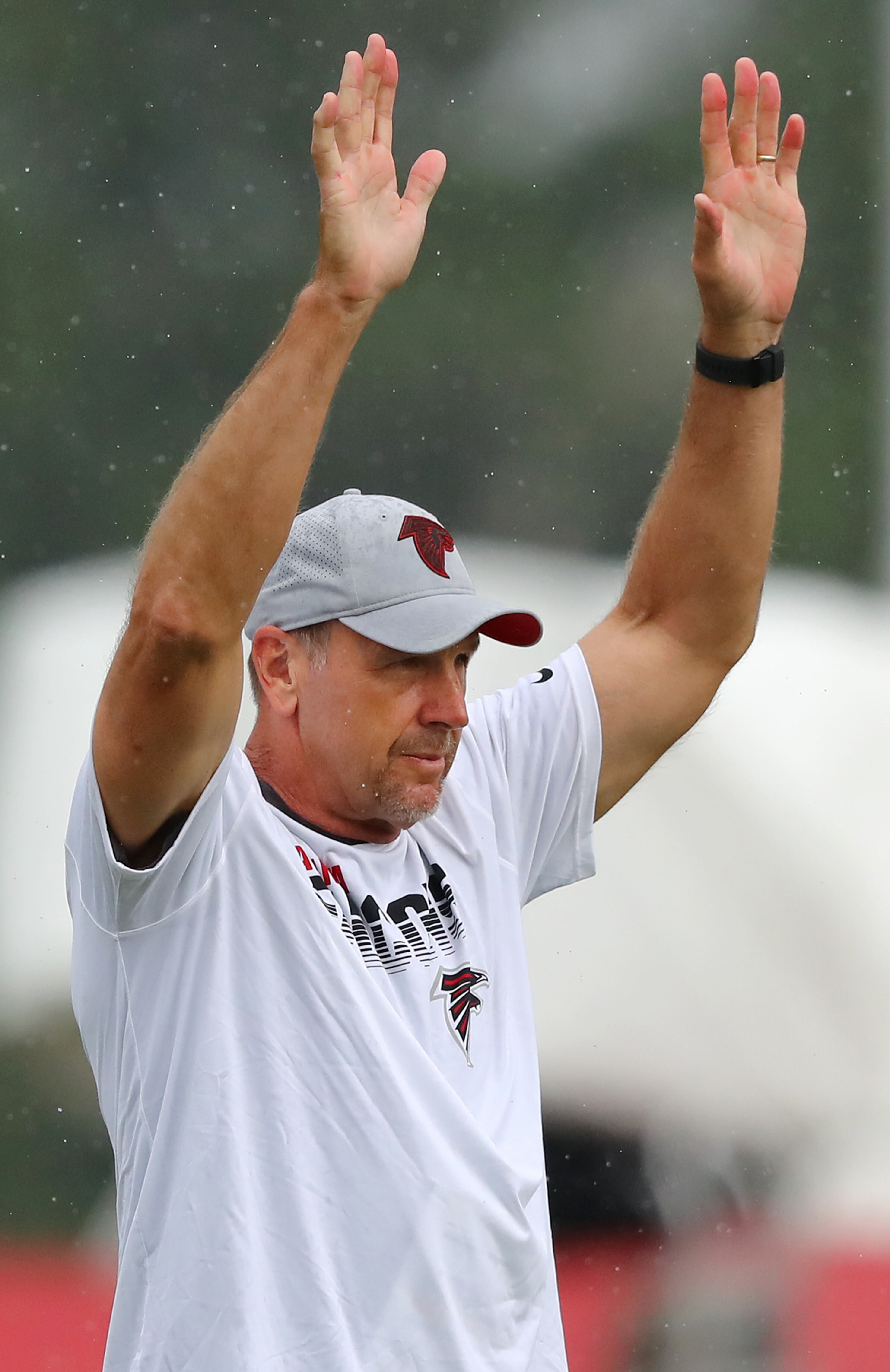 Falcons tight ends coach Mike Mularkey signals players. Curtis Compton/ccompton@ajc.com