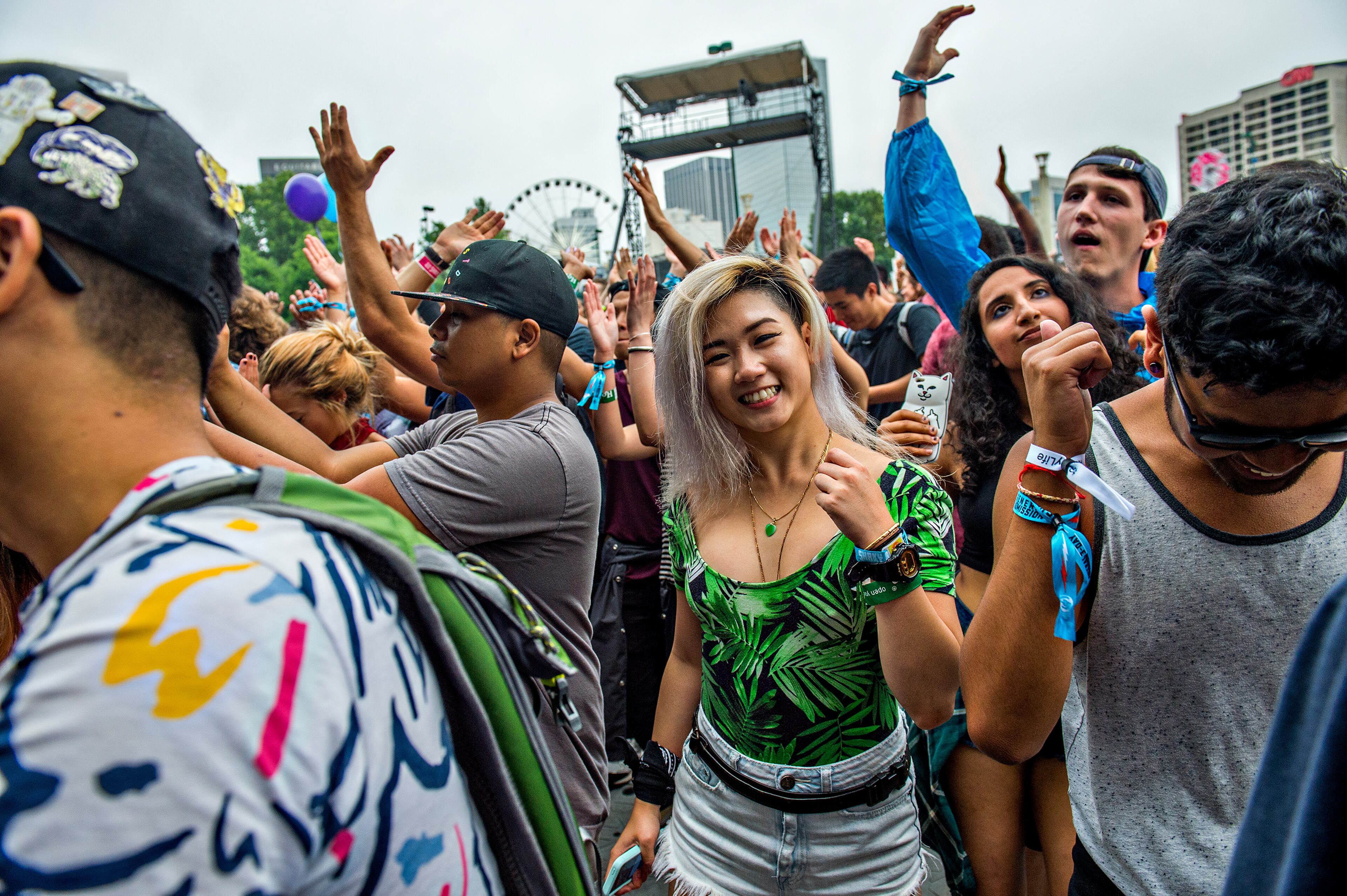 Ruth Lam (center) dances as Jai Wolf performs during the first night of the Shaky Beats Music Festival at Centennial Olympic Park in Atlanta on Friday, May 20, 2016. JONATHAN PHILLIPS / SPECIAL
