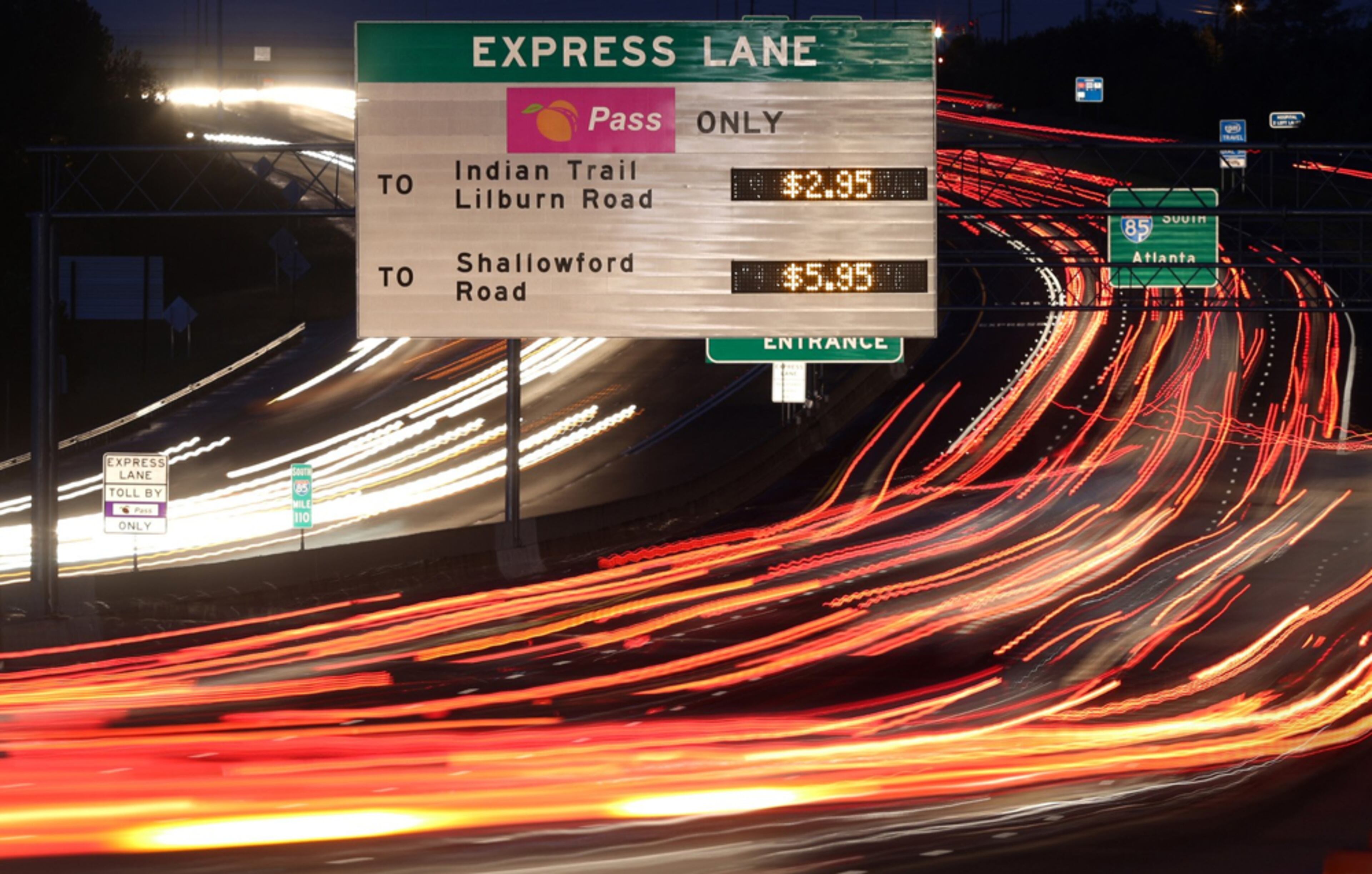 NOT SO HOT LANES--October 2, 2012 - Atlanta, Ga.,: At 7:00 AM, rush hour traffic approaches the HOT lanes entrance near the Old Peachtree Road exit with a sign posting the current charges for use of the HOT lanes on I-85 south Tuesday morning in Duluth, Ga., October 2, 2012. This is the one-year anniversary of the HOT lanes on I-85. In its first 11 months, the I-85 HOT lanes took in $3.1 million. That's less than the $3.3 million to $6.7 million state predicted it would. On Tuesday morning, the toll rate matched its Sept. 11, 2012 all-time high, charging $5.95 for a ride on the whole 16-mile lane.