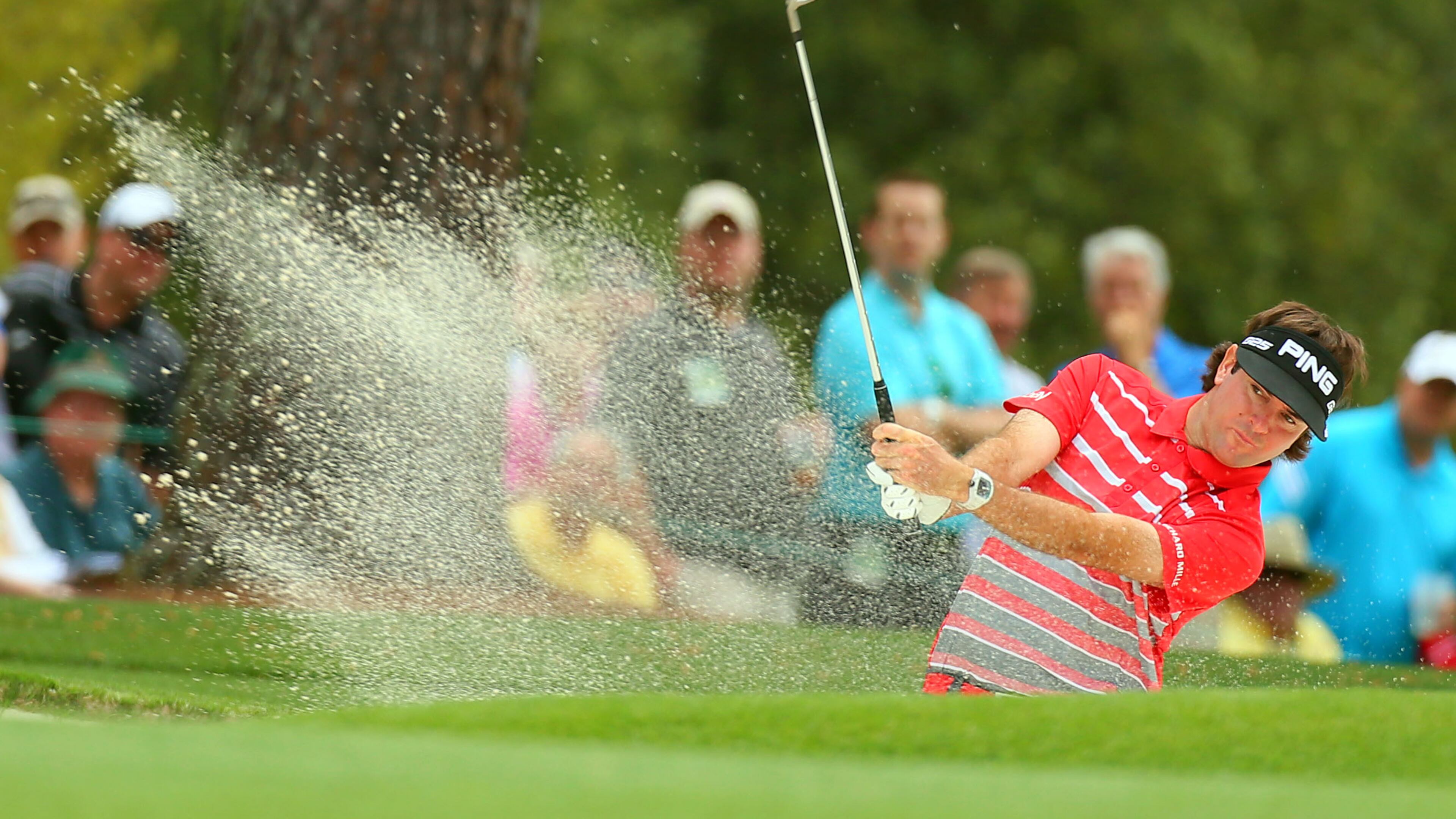 Bubba Watson hits from the bunker on No. 1 during the opening round.