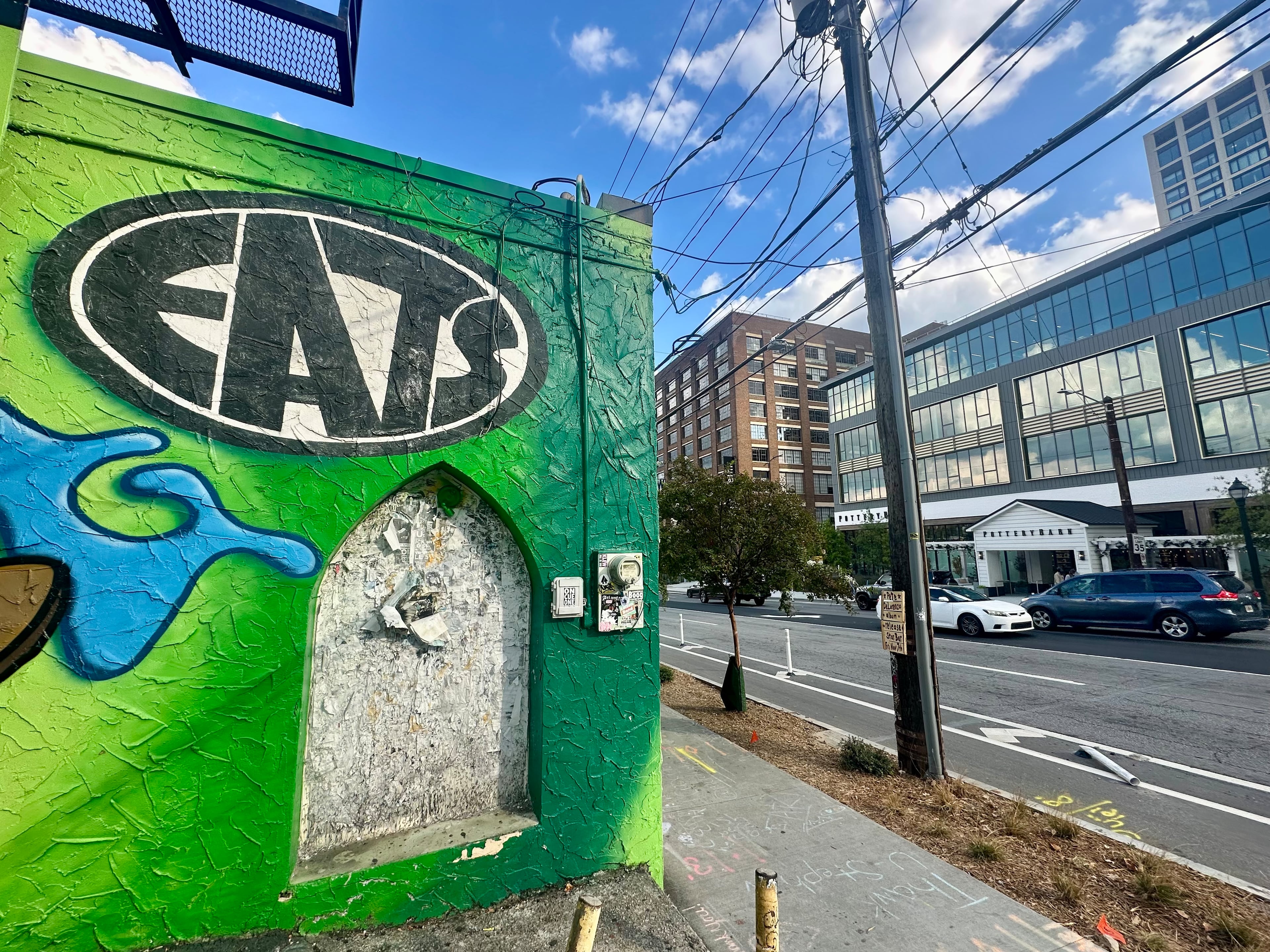The area around Eats has changed a lot in its 30-plus years. For example, a new office building at 619 Ponce de Leon Ave. has a Pottery Barn store. (Amy Wenk/AJC)