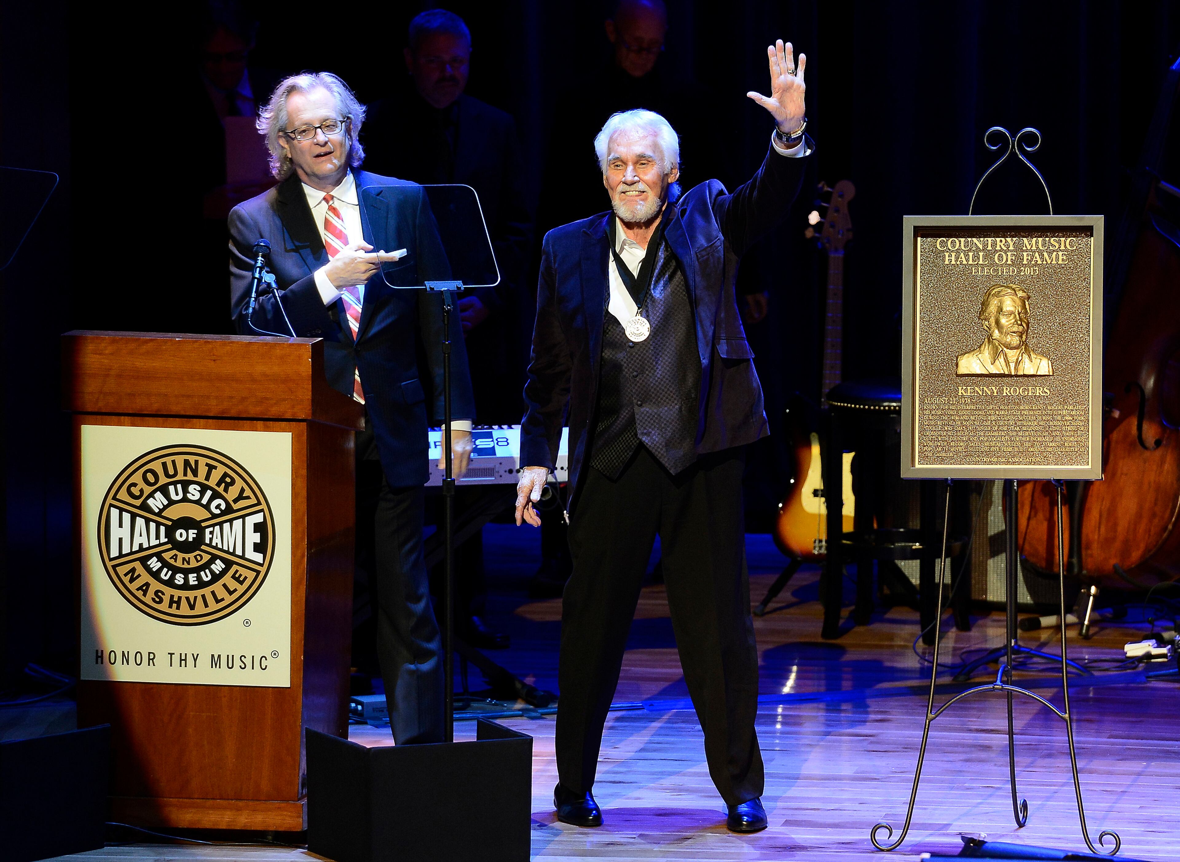 ADDS YEAR - FILE - In this Oct. 27, 2013, file photo, country music star Kenny Rogers thanks the audience at the ceremony for the 2013 inductions into the Country Music Hall of Fame in Nashville, Tenn. Actor-singer Kenny Rogers, the smooth, Grammy-winning balladeer who spanned jazz, folk, country and pop with such hits as âLucille,â âLadyâ and âIslands in the Streamâ and embraced his persona as âThe Gamblerâ on record and on TV died Friday night, March 20, 2020. He was 81. (AP Photo/Mark Zaleski, File)