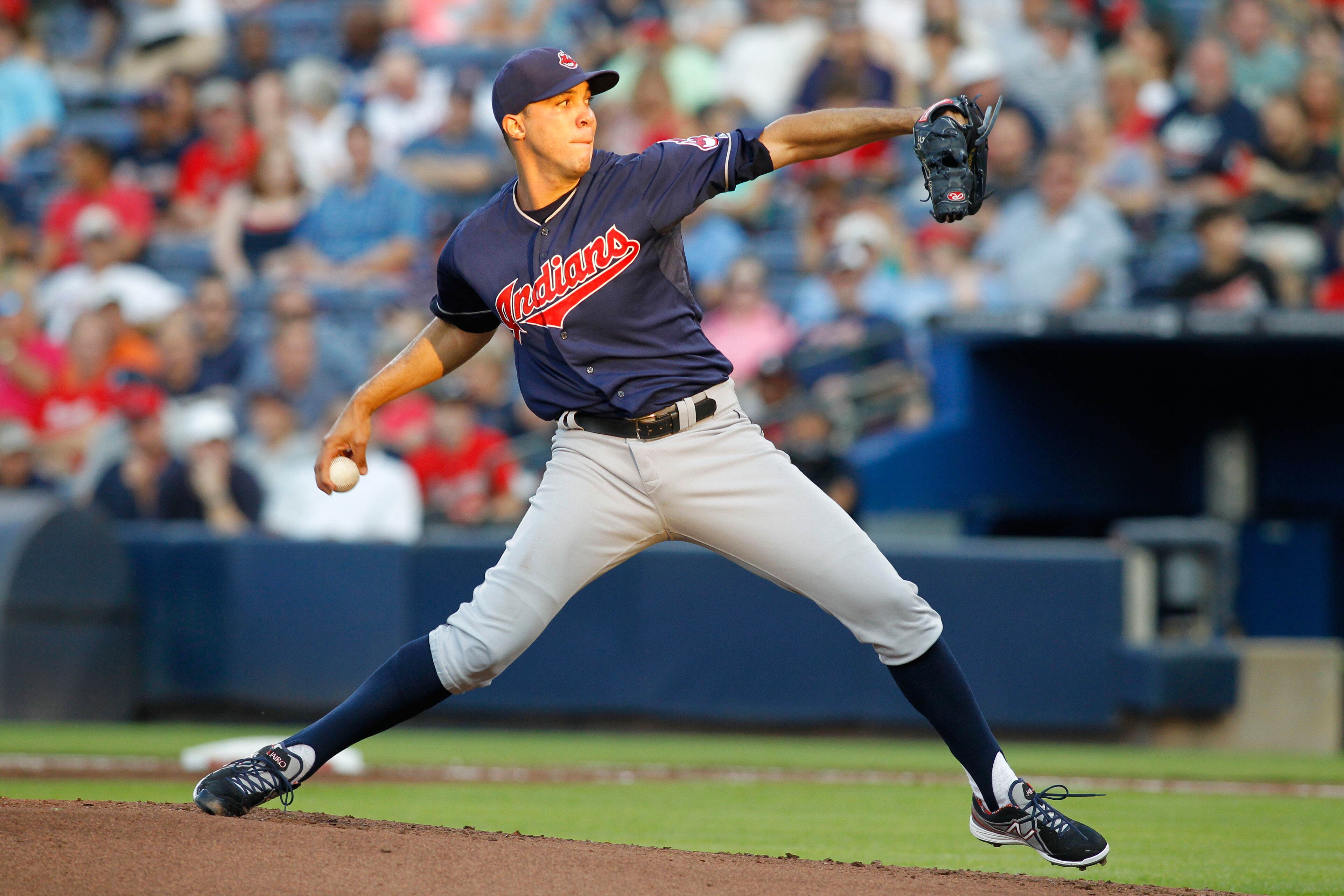 Cleveland Indians starting pitcher Ubaldo Jimenez (30) throws a pitch against the Atlanta Braves in the first inning at Turner Field. Brett Davis-USA TODAY Sports