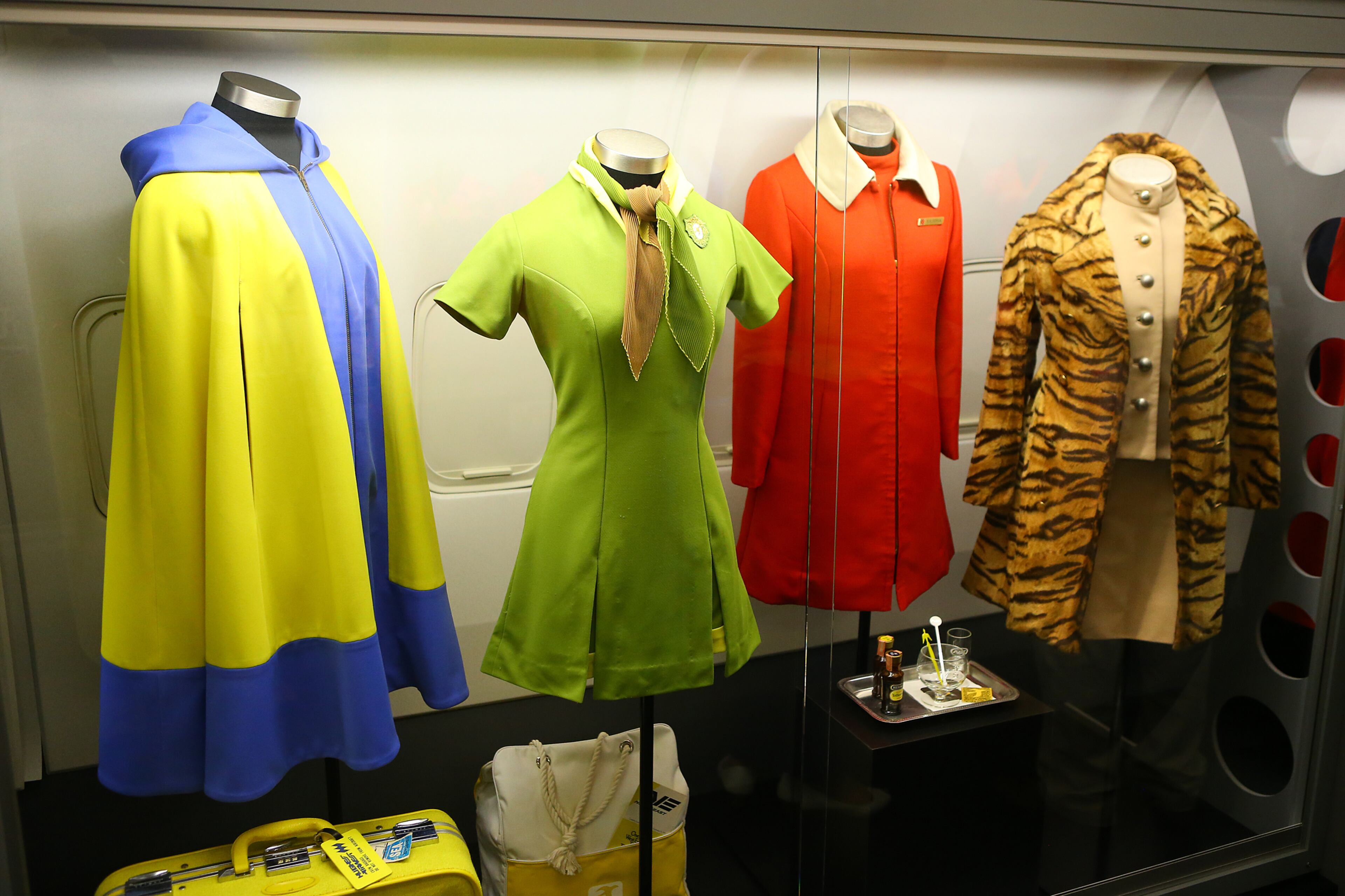 061214 ATLANTA: Flight attendant uniforms from the 1960s era including Hughes AirWest (from left to right), Northeast Airlines, and Northwest Airlines are on display at the Delta Flight Museum on Thursday, June 12, 2014, in Atlanta. CURTIS COMPTON / CCOMPTON@AJC.COM
