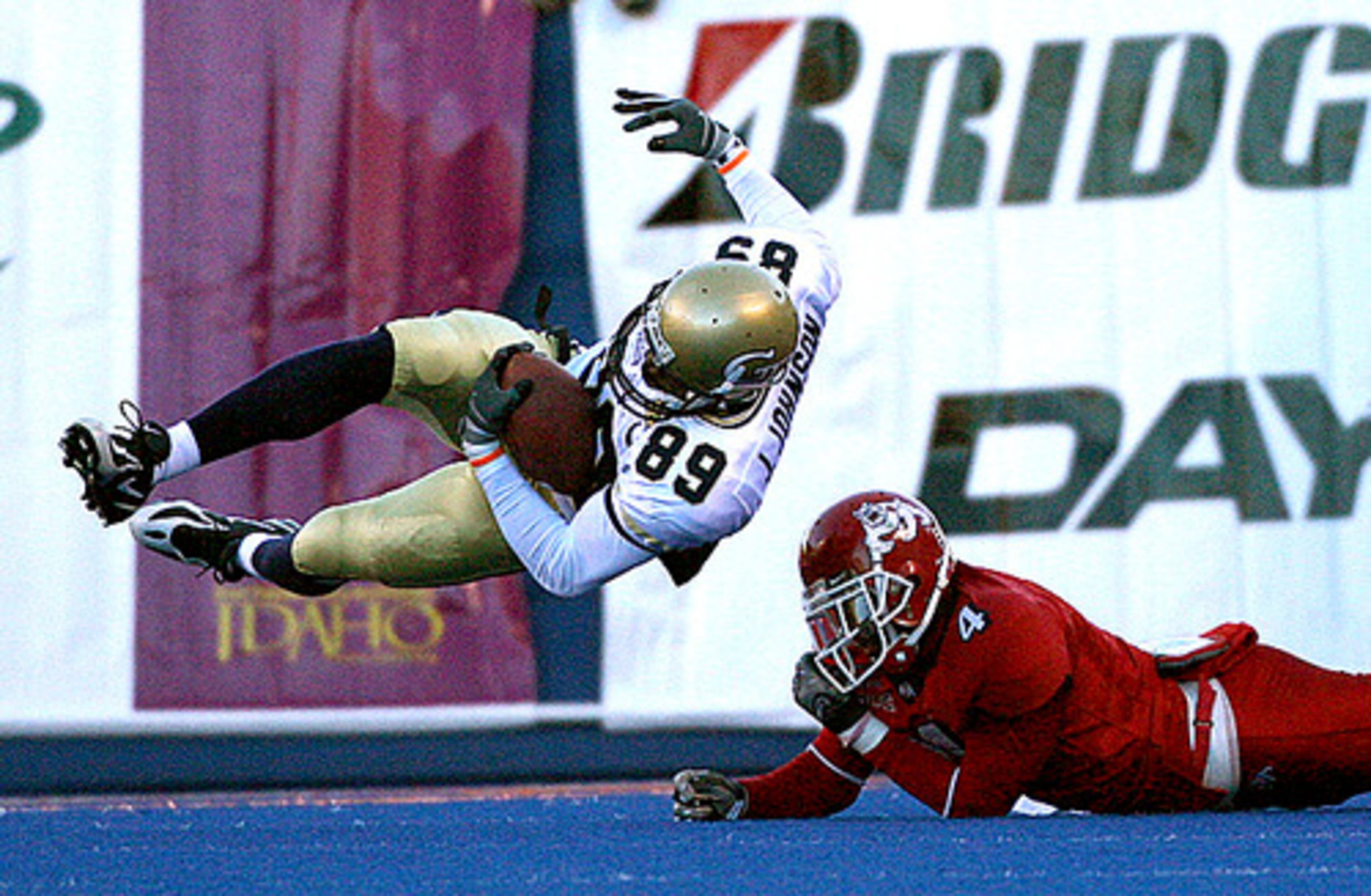 Tech's James Johnson gets knocked off his feet by Fresno State's Damion Owens.