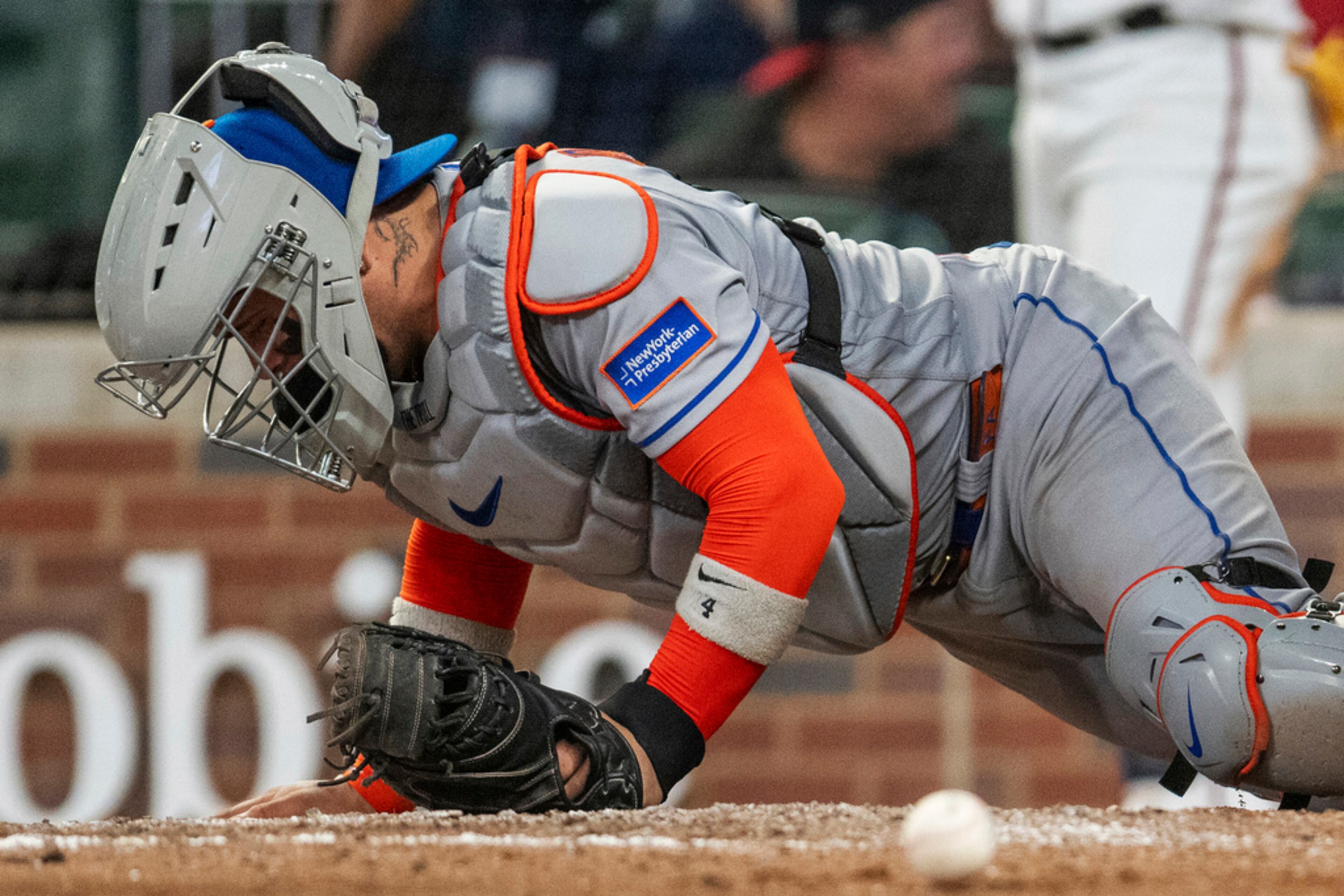 New York Mets catcher Francisco Alvarez gets up after being hit by the ball during the sixth inning of the team's baseball game against theAtlanta Braves, Wednesday, Aug. 23, 2023, in Atlanta. (AP Photo/Hakim Wright Sr.)