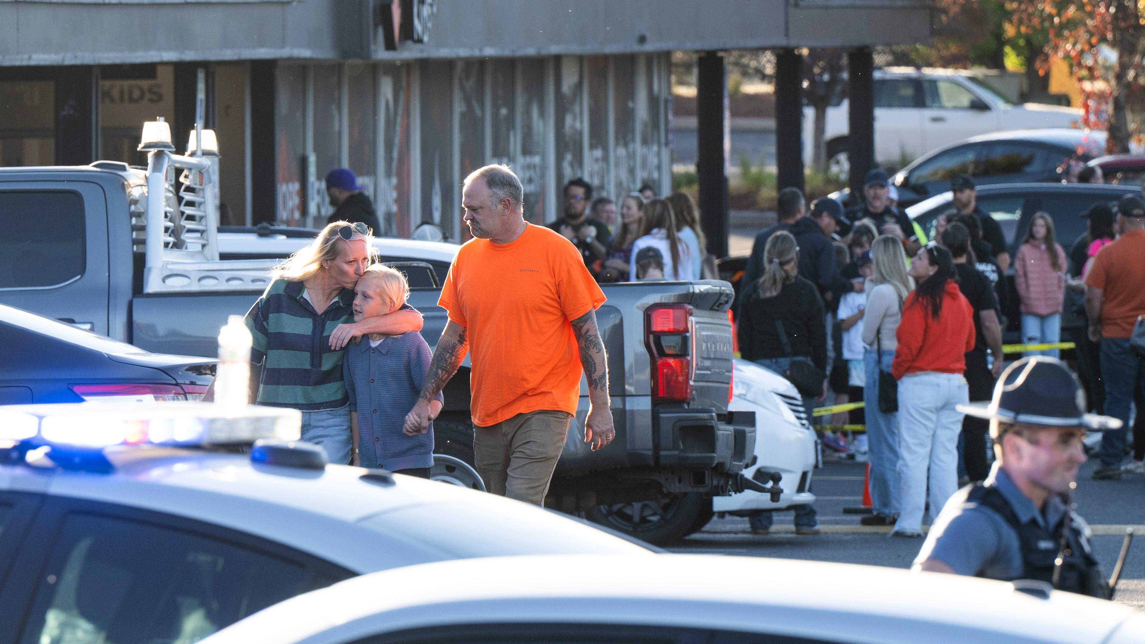 People leave a family meeting area following a shooting at Silver Rail Elementary School, Thursday, Oct. 15, 2026, in Bend, Ore. (AP Photo/Joe Kline)