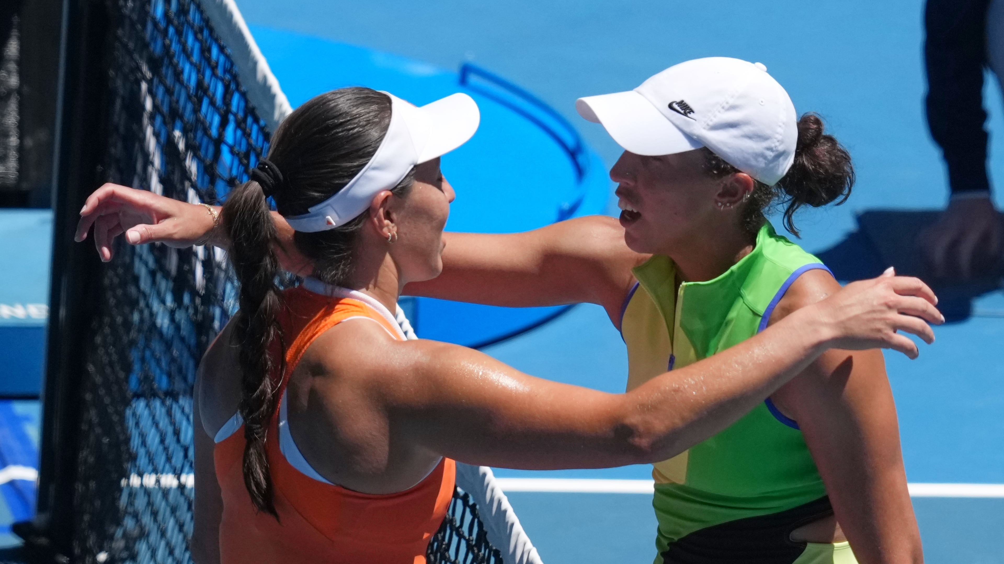 Jessica Pegula, left, of the U.S., is congratulated by her compatriot Madison Keys after winning their fourth round match at the Australian Open tennis championship in Melbourne, Australia, Monday, Jan. 26, 2026. (AP Photo/Asanka Brendon Ratnayake)
