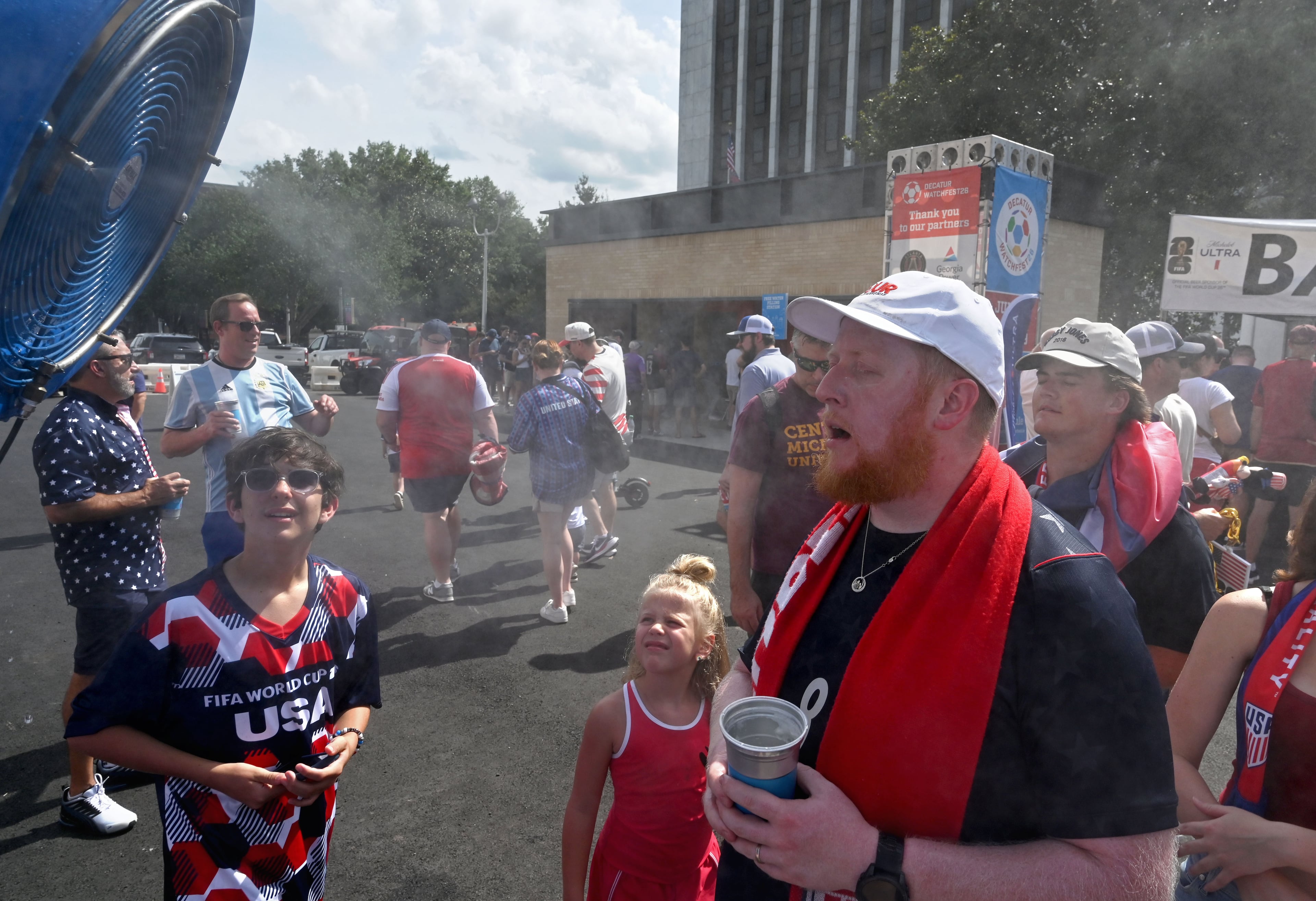 USA soccer fans cool down at halftime of the USA vs. Australia game during Decatur WatchFest at Decatur Square on Friday, June 19, 2026. (Hyosub Shin/AJC)