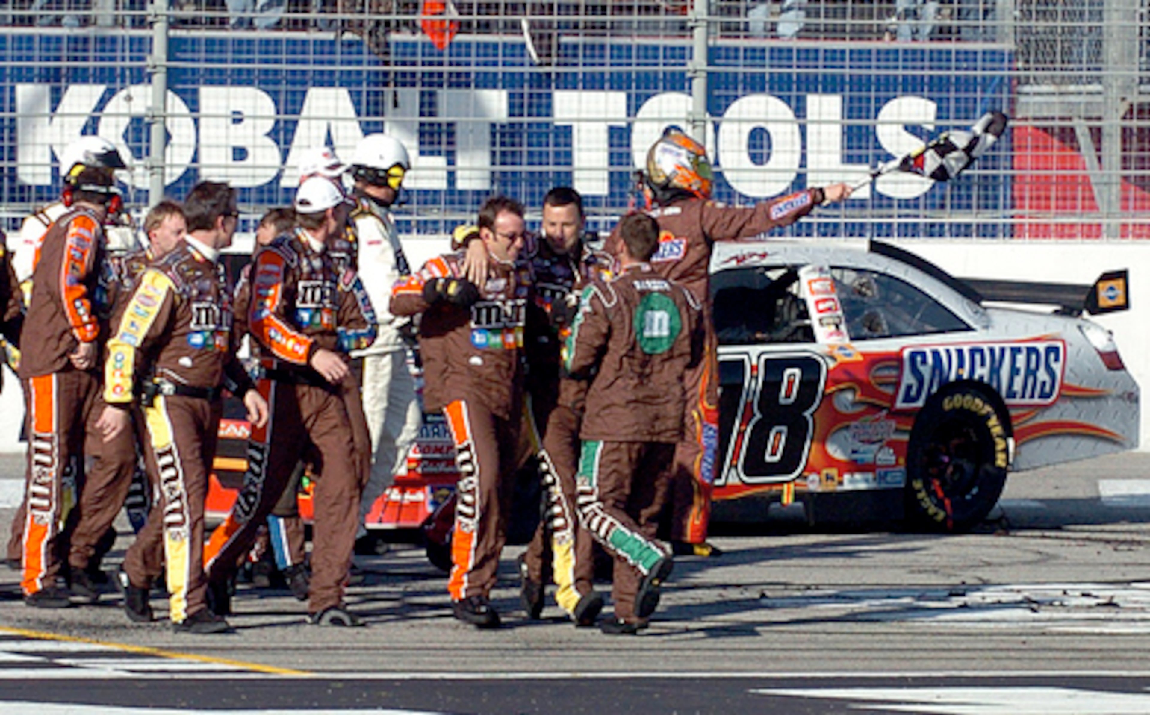 Busch's team celebrates his win with him at the finish line of the Atlanta Motor Speedway.