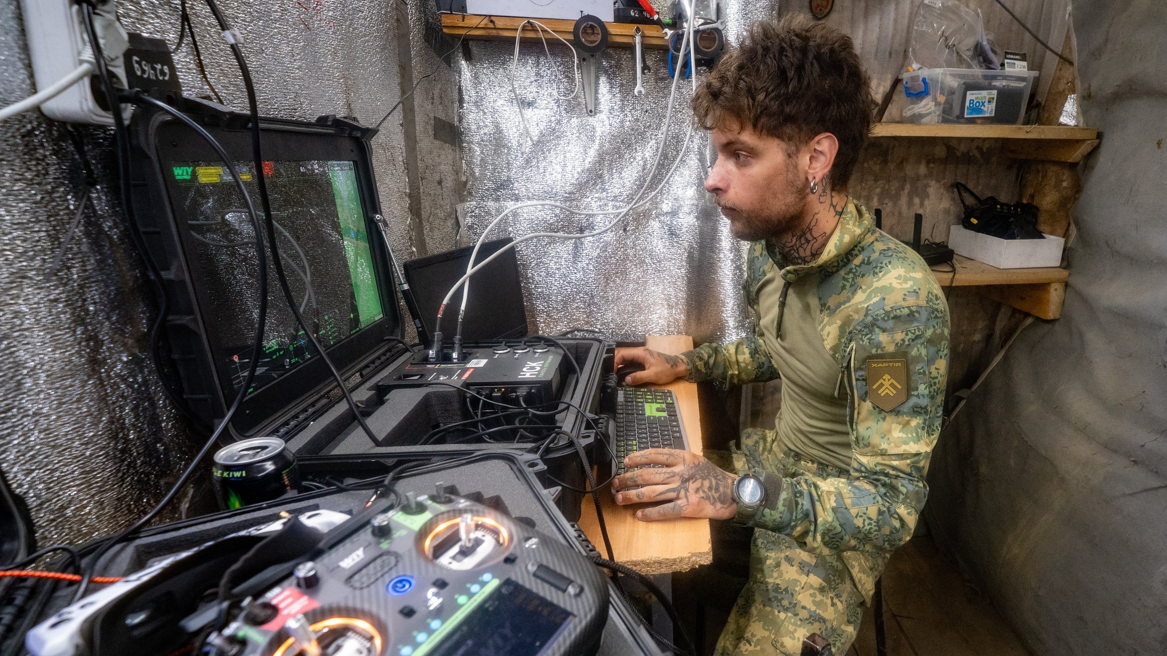 A Ukrainian serviceman of Khartia brigade controls an interceptor drone in the command centre Kharkiv region, Ukraine, Friday, June 26, 2026. (AP Photo/Andrii Marienko)