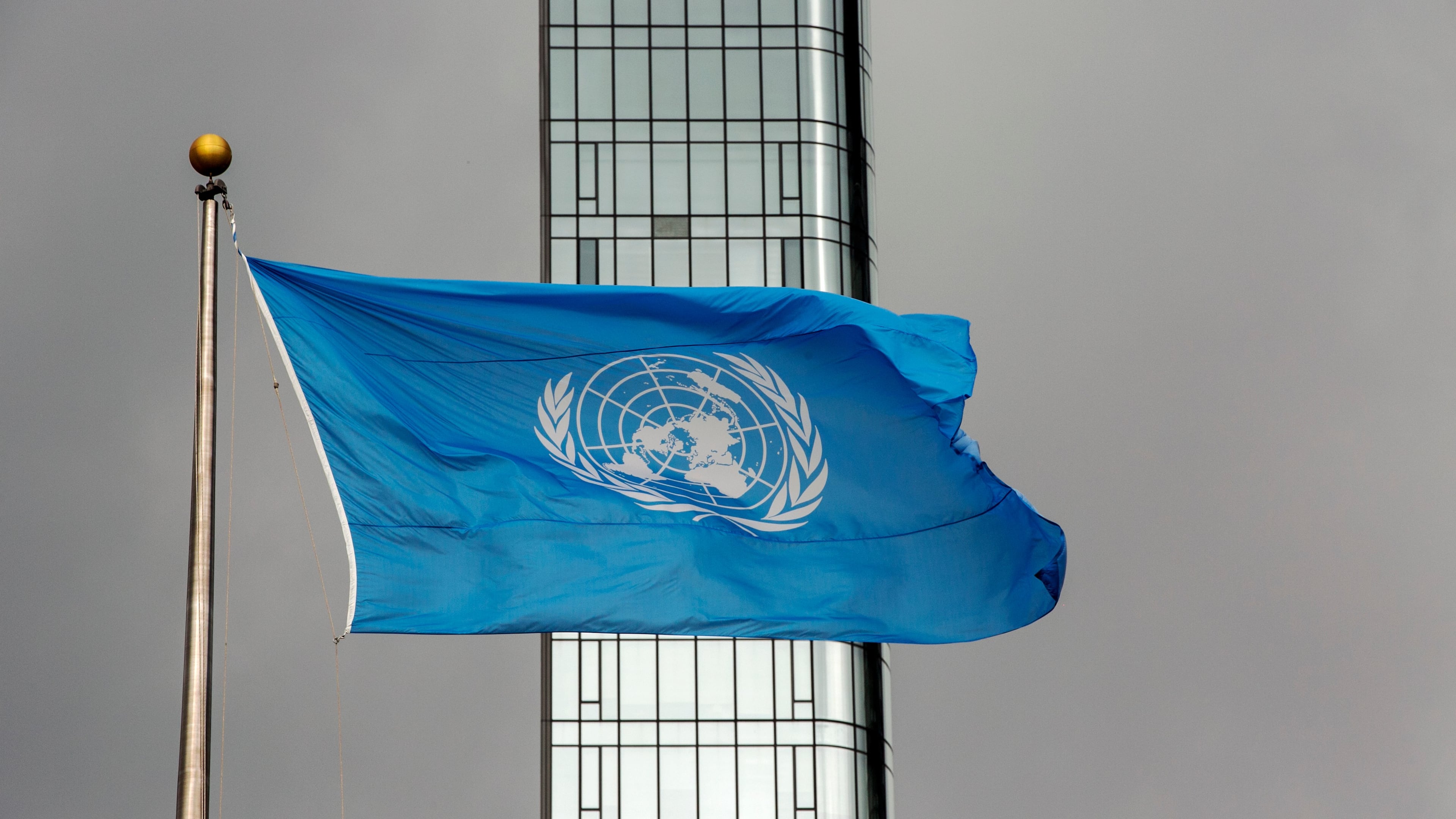 FILE - The UN flag flies on a stormy day at the United Nations during the United Nations General Assembly, Sept. 22, 2022. (AP Photo/Ted Shaffrey, File)