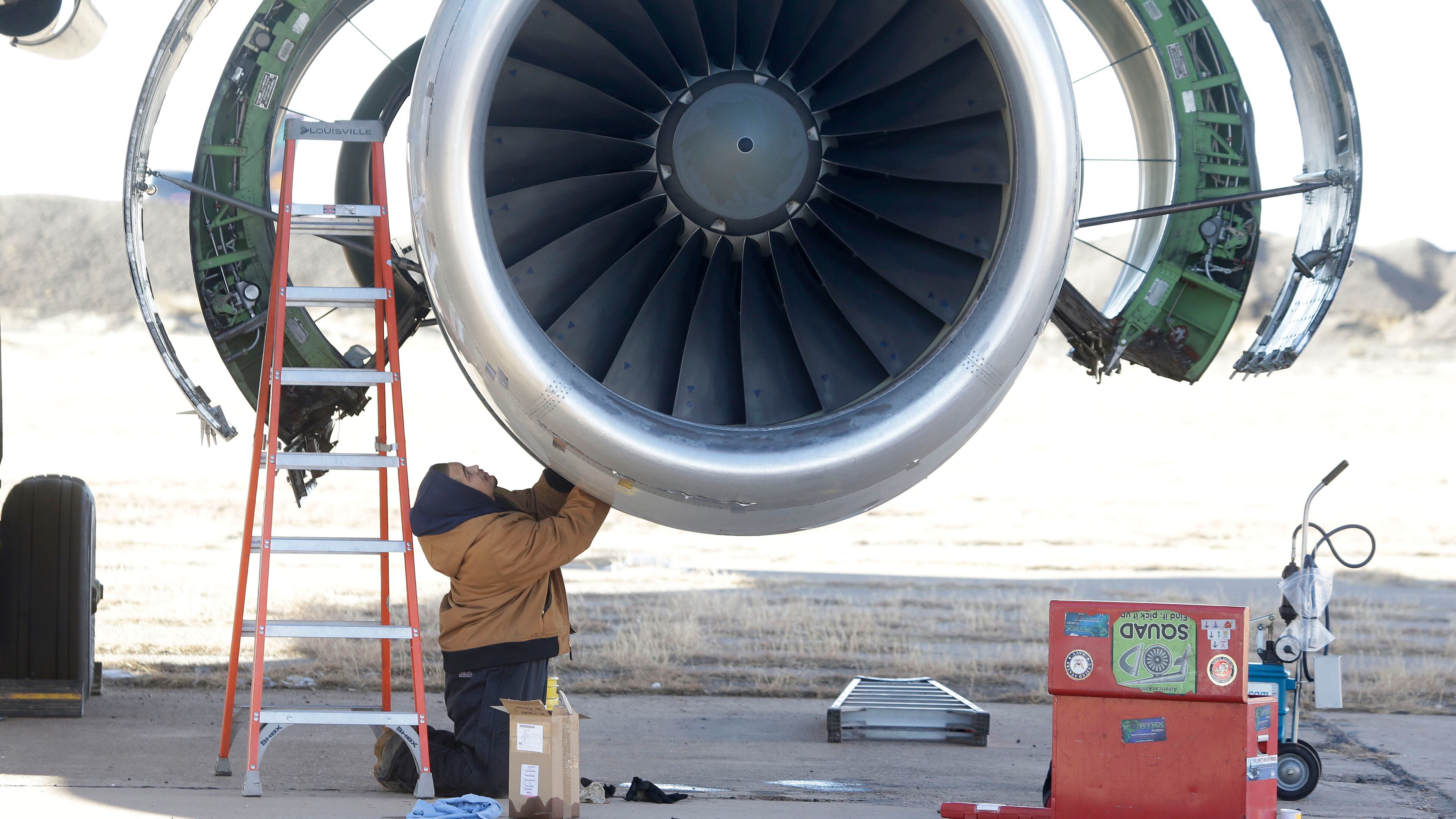 In this photo Tuesday, Dec. 10, 2013, photo, parts are removed from a retired American Airlines' jet engine in Roswell, New Mexico. (AP Photo/LM Otero)