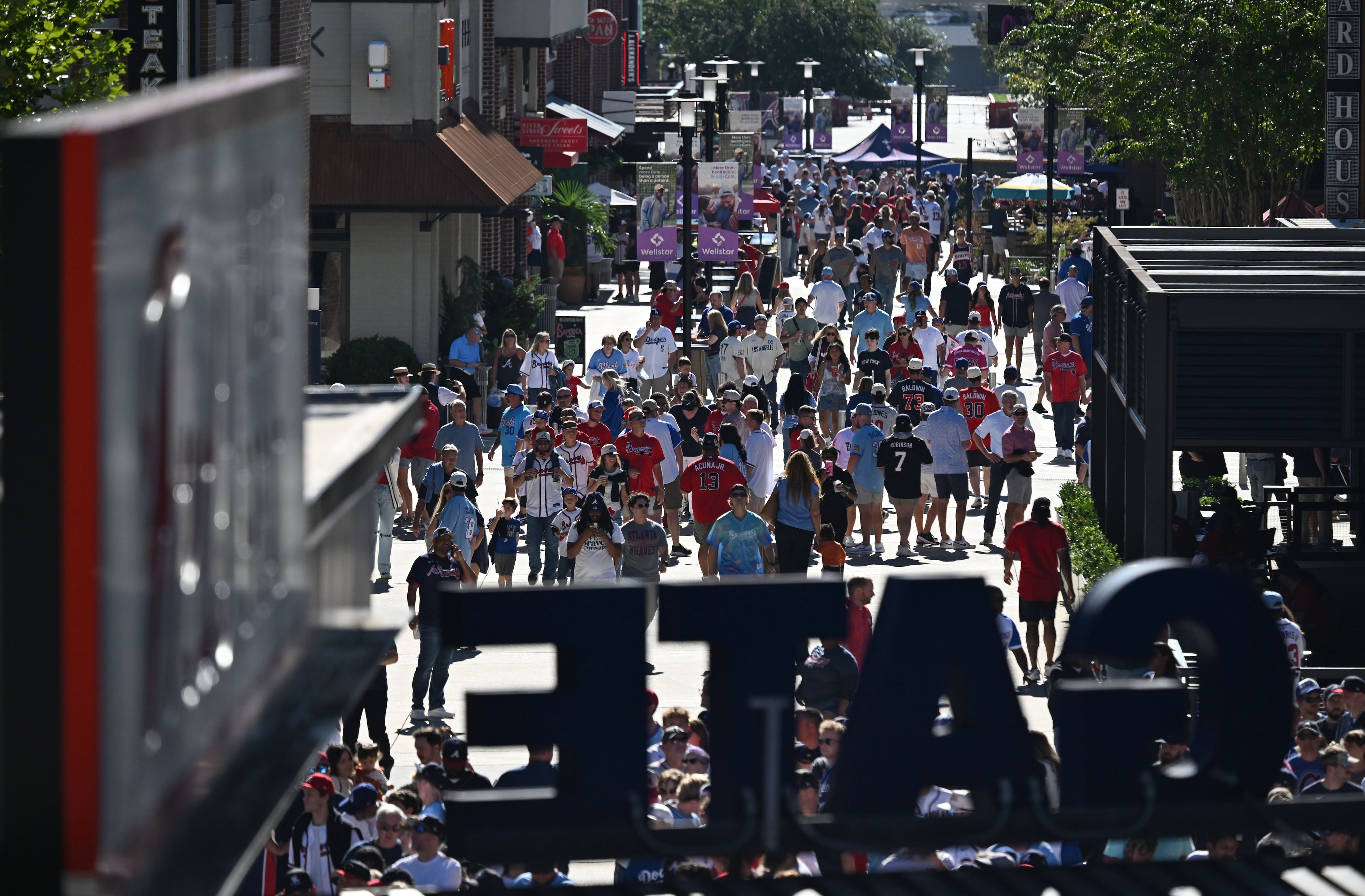Baseball fans wait for the gates to open before Game 3 of the National League Division Series between Atlanta Braves and Los Angeles Dodgers at Truist Park on Tuesday, Oct. 6, 2026, in Atlanta. (Hyosub Shin/AJC)
