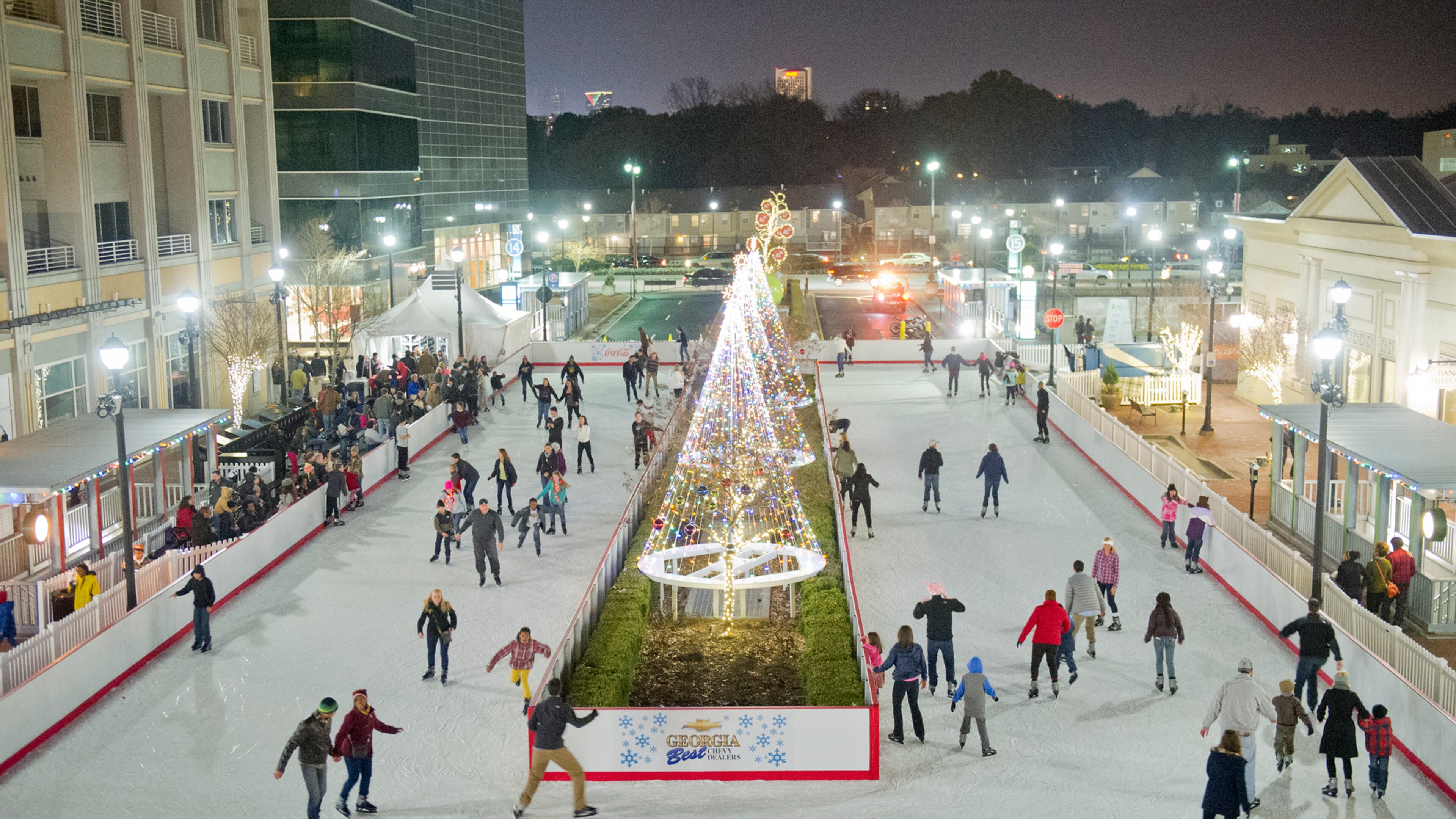 People skate in the open air ice rink at Atlantic Station in Atlanta during the annual Christmas tree lighting on Nov. 23, 2013.