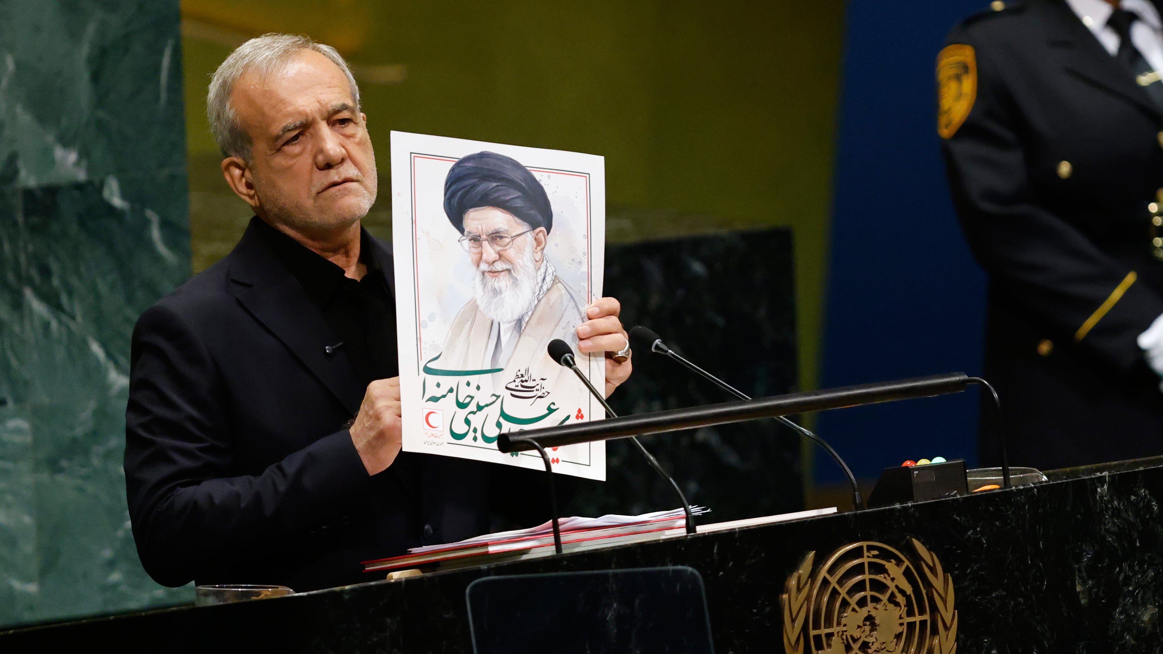 Iran's President Masoud Pezeshkian holds an image of late Iranian Supreme Leader Ayatollah Ali Khamenei during the 81st session of the United Nations General Assembly at United Nations headquarters, Wednesday, Sept. 23, 2026. (AP Photo/Stefan Jeremiah)