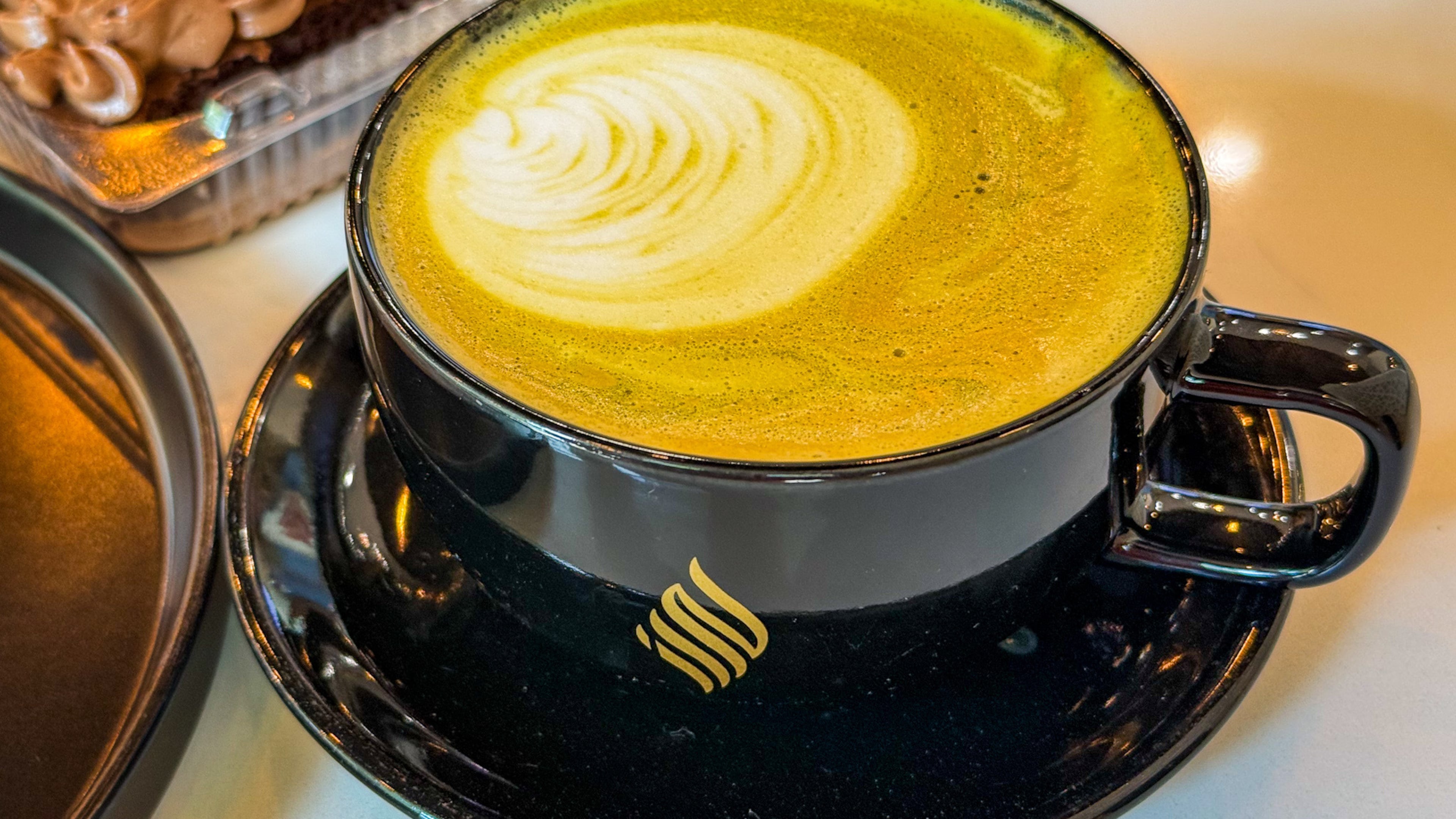 You can find a pistachio latte at Haraz Coffee Roasters, a Yemeni-style coffee house, in Midtown. (Henri Hollis/AJC)