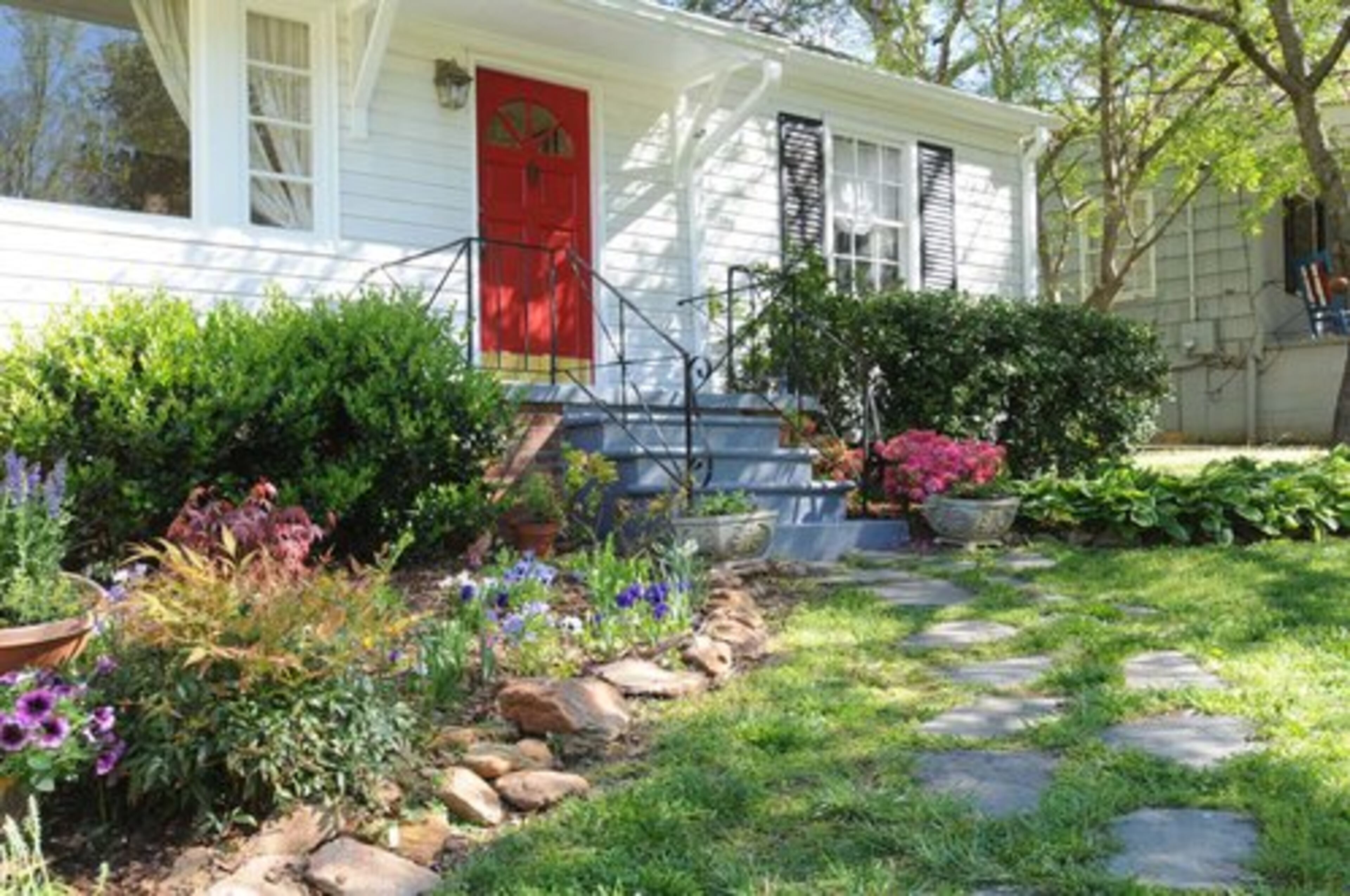 While color experts advise neutrals on home exteriors, agent Troy Wells said this pop of red works well to dramatize this Brookhaven home's front entrance. His advice for sellers is, first and foremost, to keep the exterior of the home consistent with the neighborhood.