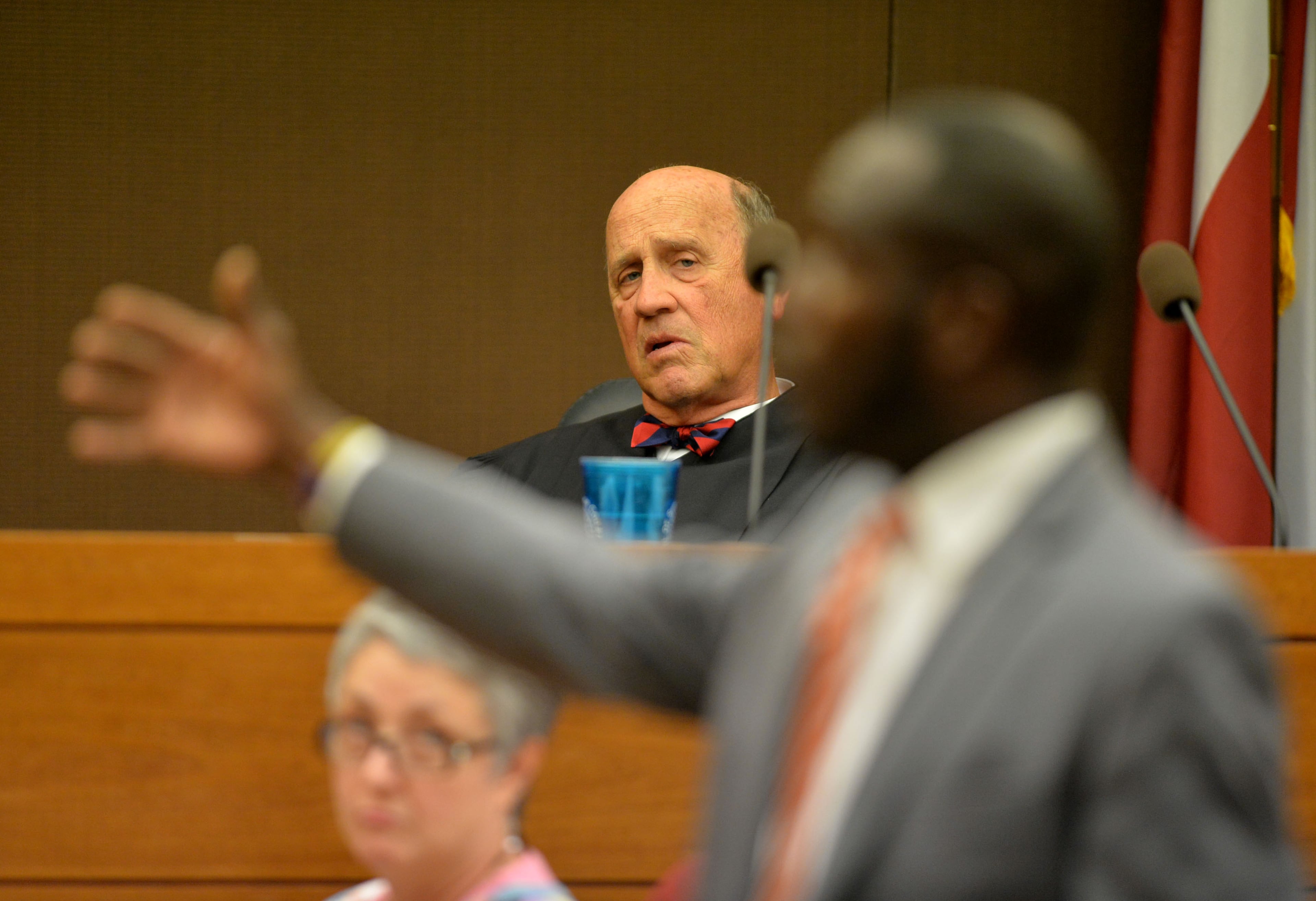 Judge Jerry Baxter listens as Keith Adams, defense attorney for former APS teacher Diane Buckner-Webb, makes his opening statement Monday afternoon. KENT D. JOHNSON / KDJOHNSON@AJC.COM