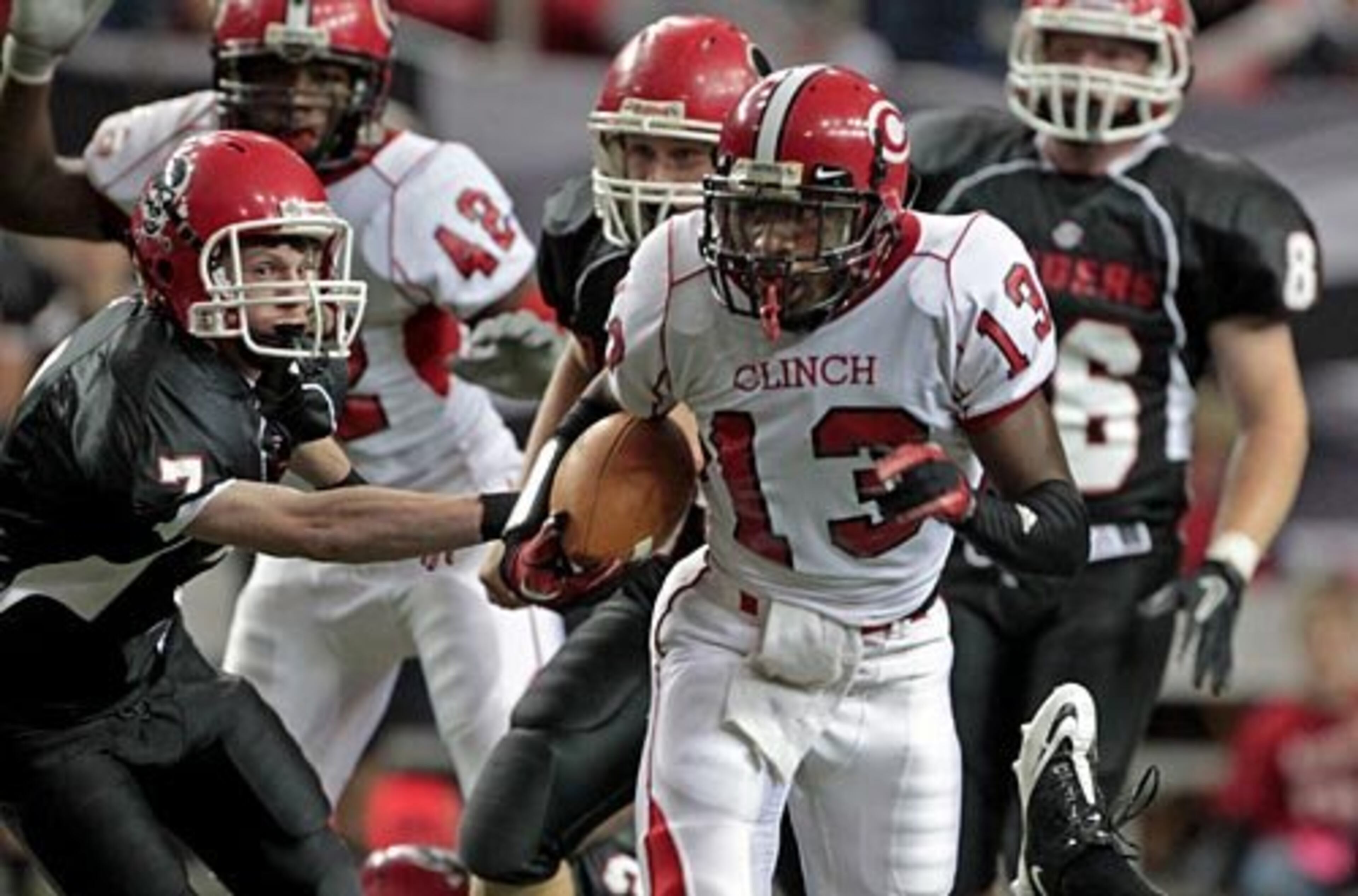 Clinch County's Damian Magby (13) gets by Savannah Christian punter Mac Miller (left) for a touchdown on a first half punt return.