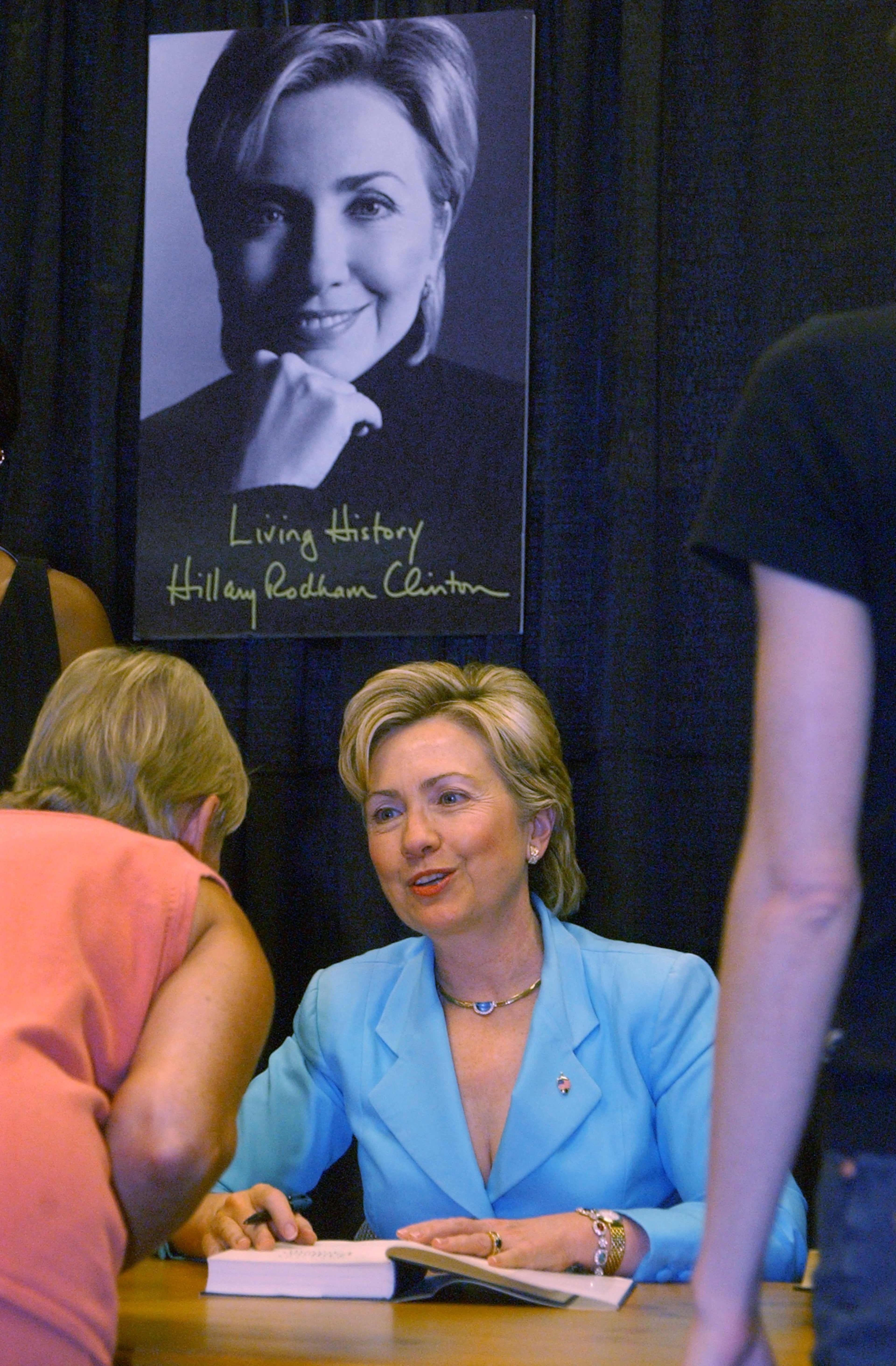 U.S. Sen. Hillary Rodham Clinton chats up a fan as she appeared at the Buckhead Atlanta Barnes and Noble bookstore on August 11, 2003 on her tour to promote her book, 'Living History'. Clinton signed books for about 90 minutes.