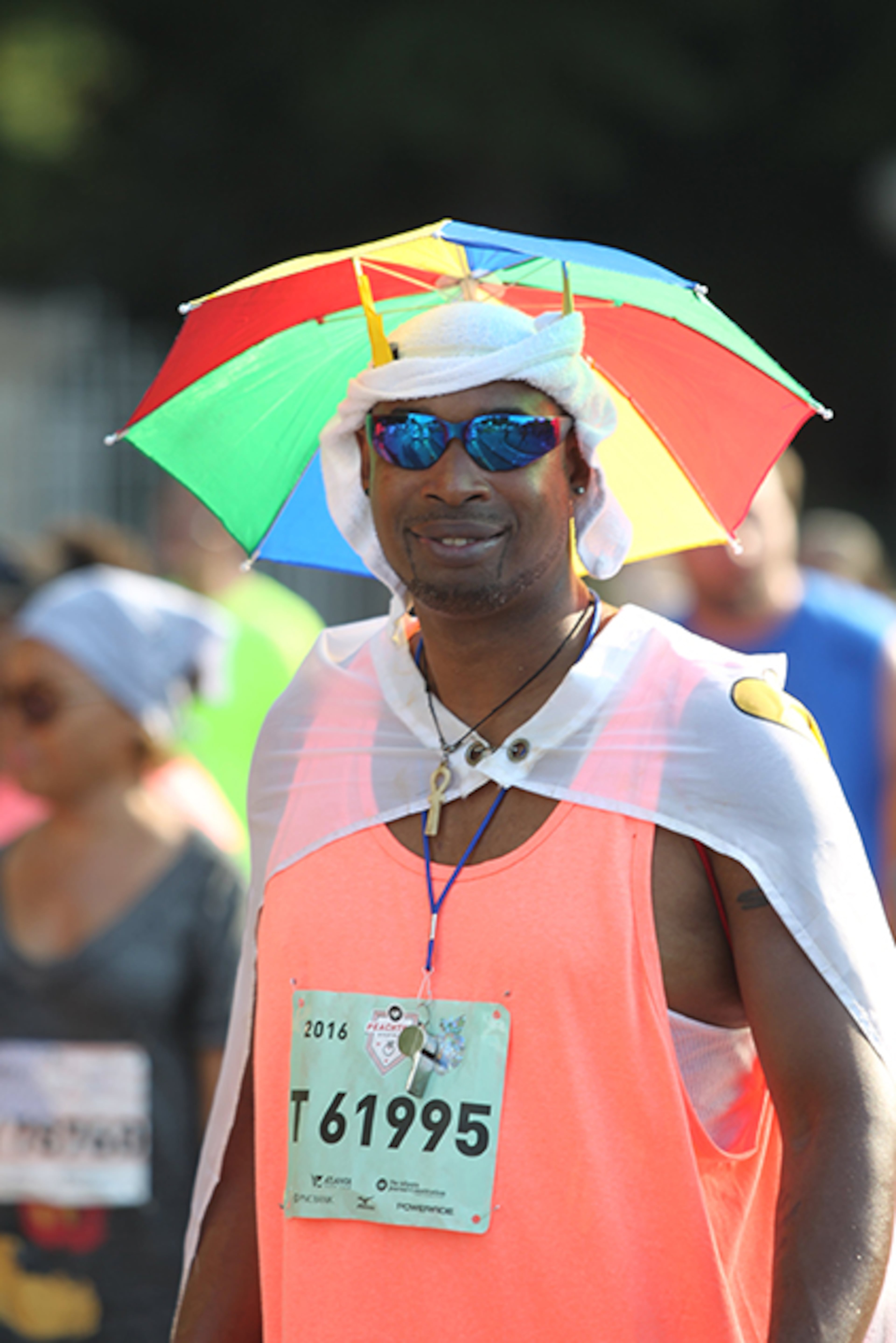 Lots of AJC Peachtree Road Race participants came prepared for the weather Monday, July 4, 2016. Temperatures at start hovered in the high 70s, before climbing to 80s, causing a red alert to be issued on the course.