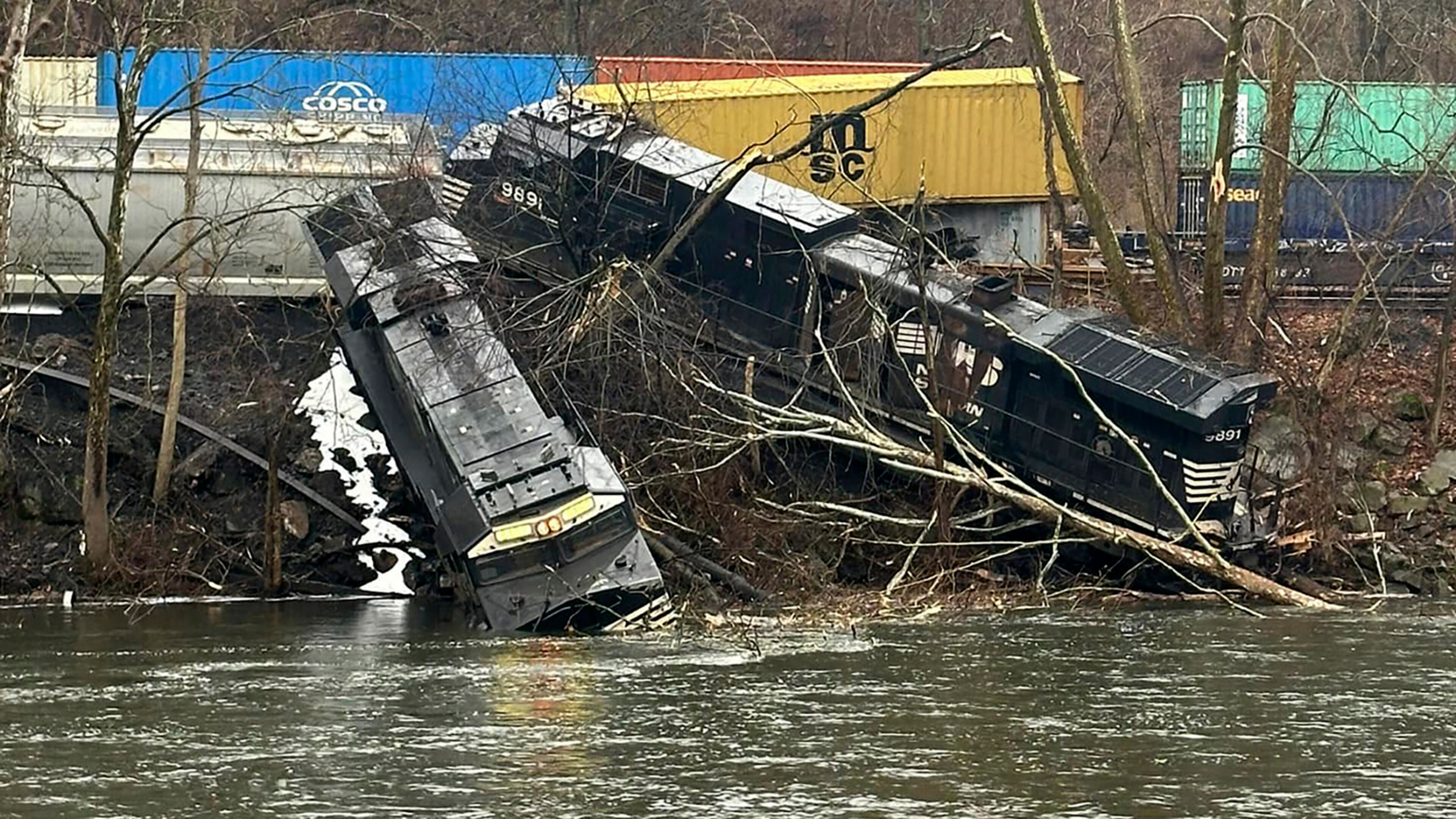 This photo provided by Nancy Run Fire Company shows a train derailment along a riverbank in Saucon Township, Pa., on Saturday, March 2, 2024. Authorities said it was unclear how many cars were involved but no injuries or hazardous materials were reported. (Nancy Run Fire Company via AP)