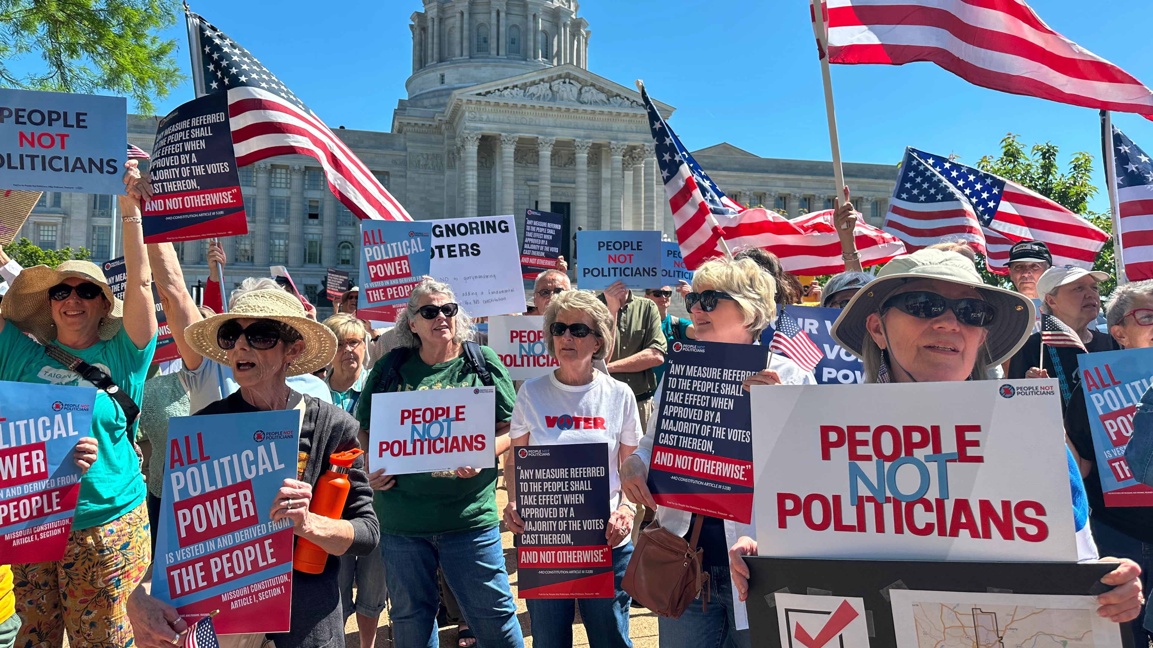 Protesters against a Missouri congressional redistricting plan gather outside the Missouri Capitol on Tuesday, May 12, 2026, in Jefferson City, Mo. (AP Photo/David A. Lieb)
