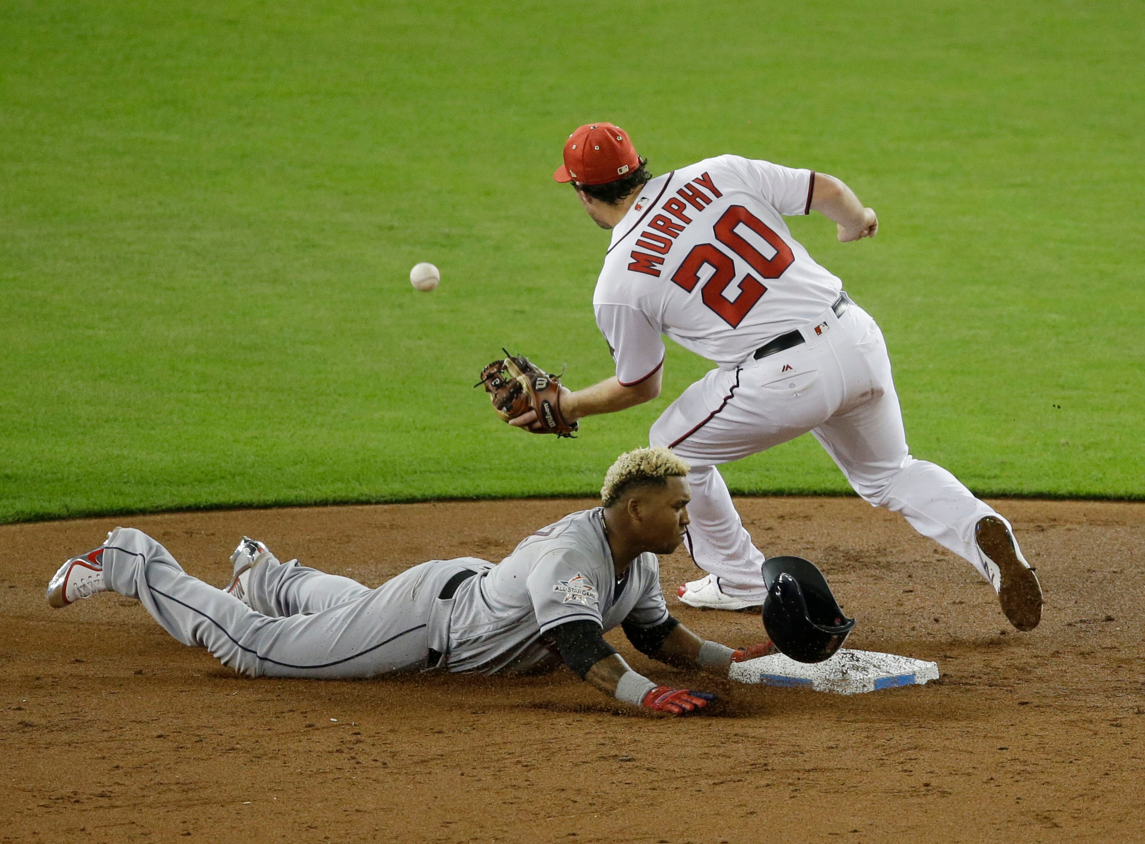 American League's Cleveland Indians José Ramĺrez (11), steals second base as National League's Washington Nationals second baseman Daniel Murphy (20) is late with the tag, during the third inning, during the MLB baseball All-Star Game, Tuesday, July 11, 2017, in Miami.(AP Photo/Alan Diaz)