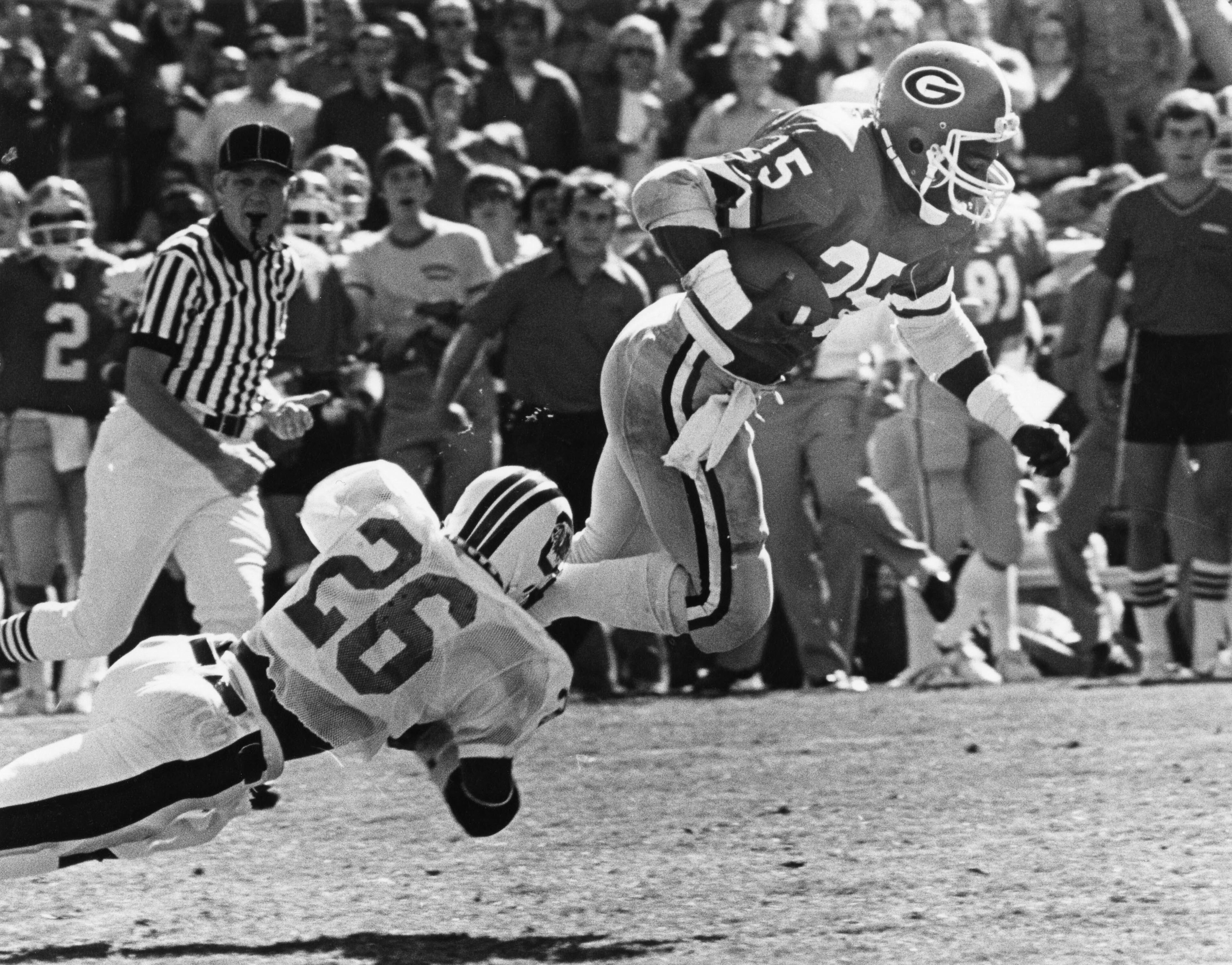 Former Georgia fullback Jimmy Womack was remembered fondly by family, friends and former UGA and high school teammates Saturday in Warner Robins. Womack died Tuesday following complications surrounding hip-replacement surgery. He was 56. In this photo, Womack gets tripped up by a South Carolina tackler in 1980. Nancy Mangiafico / AJC