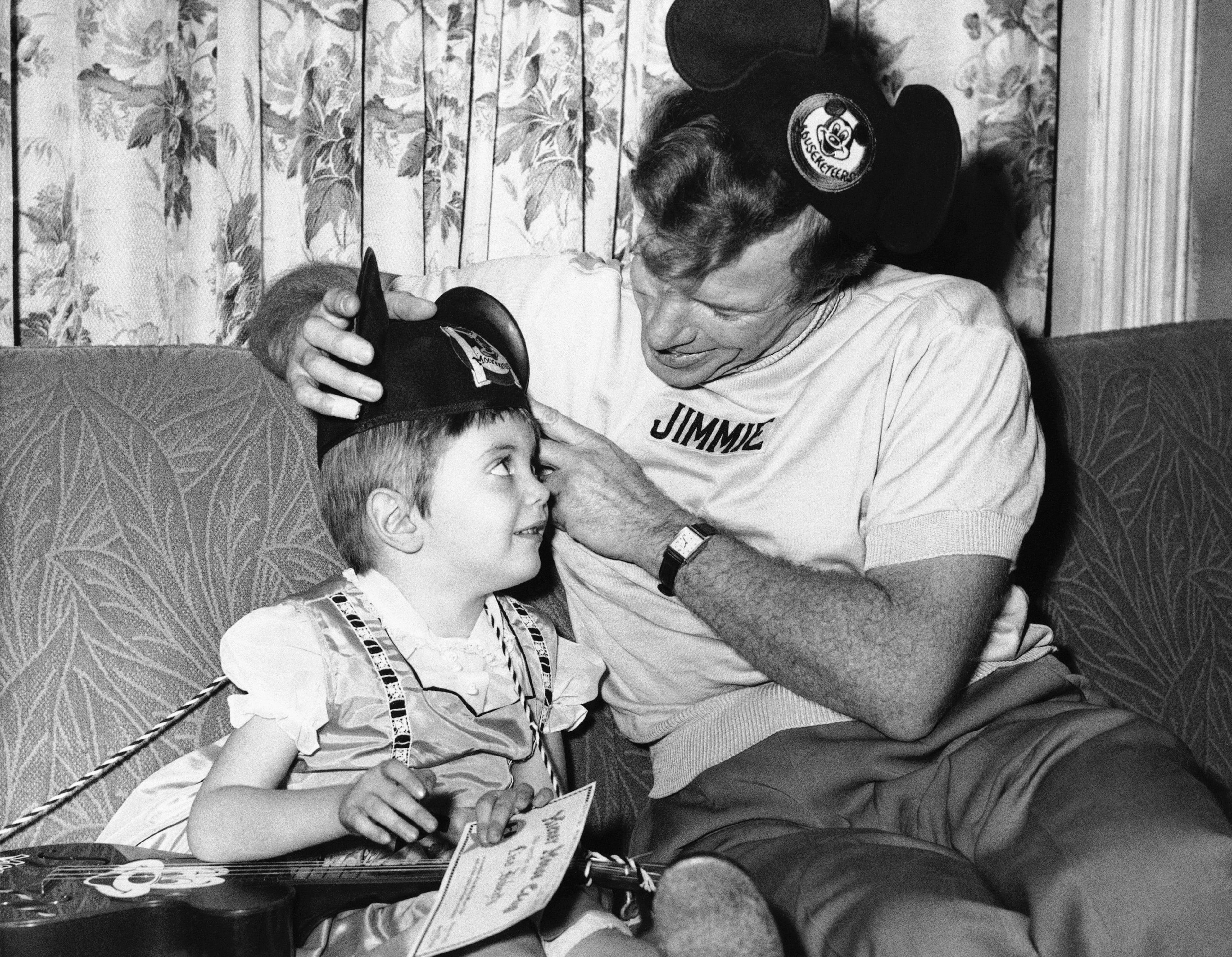 Here's your "Ears" with these official words Lisa Dougherty of Syracuse, New York shown Feb. 17, 1957, became a musketeer. Her hero TV Jimmie Dodd flew in to see the youngster who has a brain tumor and has been given only months to live. (AP Photo)