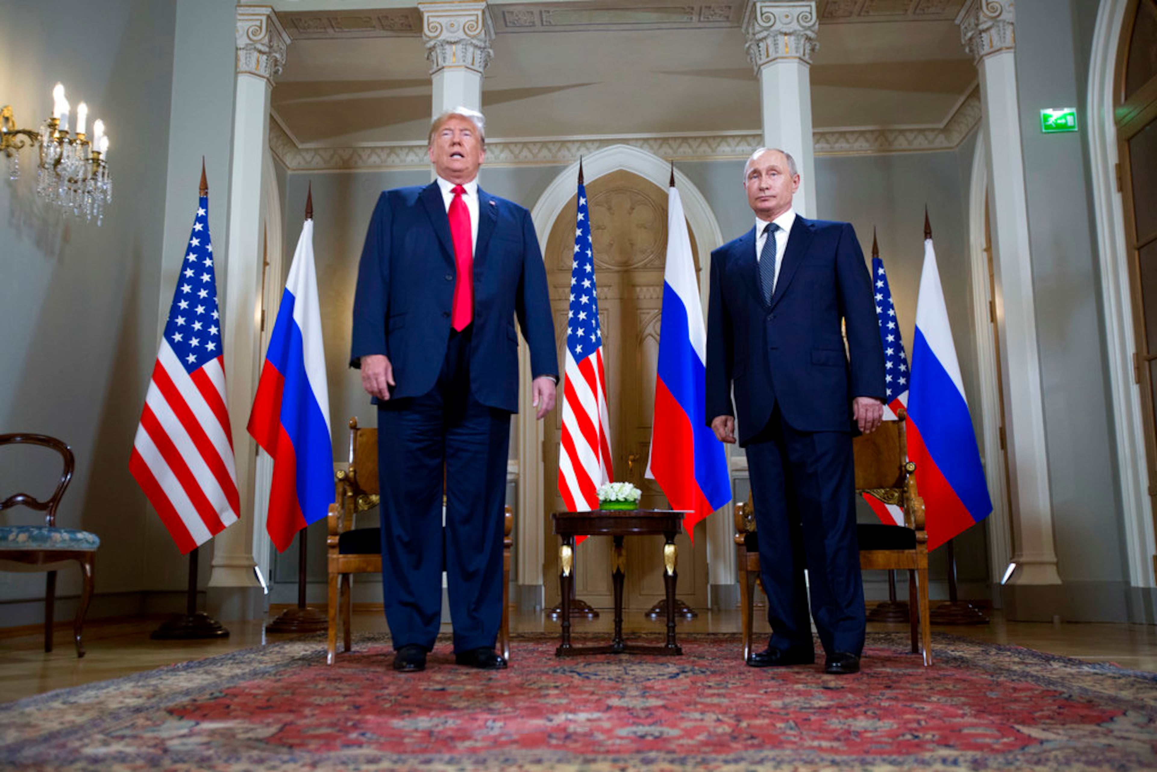 U.S. President Donald Trump, left, and Russian President Vladimir Putin pose for a photograph at the beginning of a one-on-one meeting at the Presidential Palace in Helsinki, Finland, Monday, July 16, 2018. (AP Photo/Pablo Martinez Monsivais)