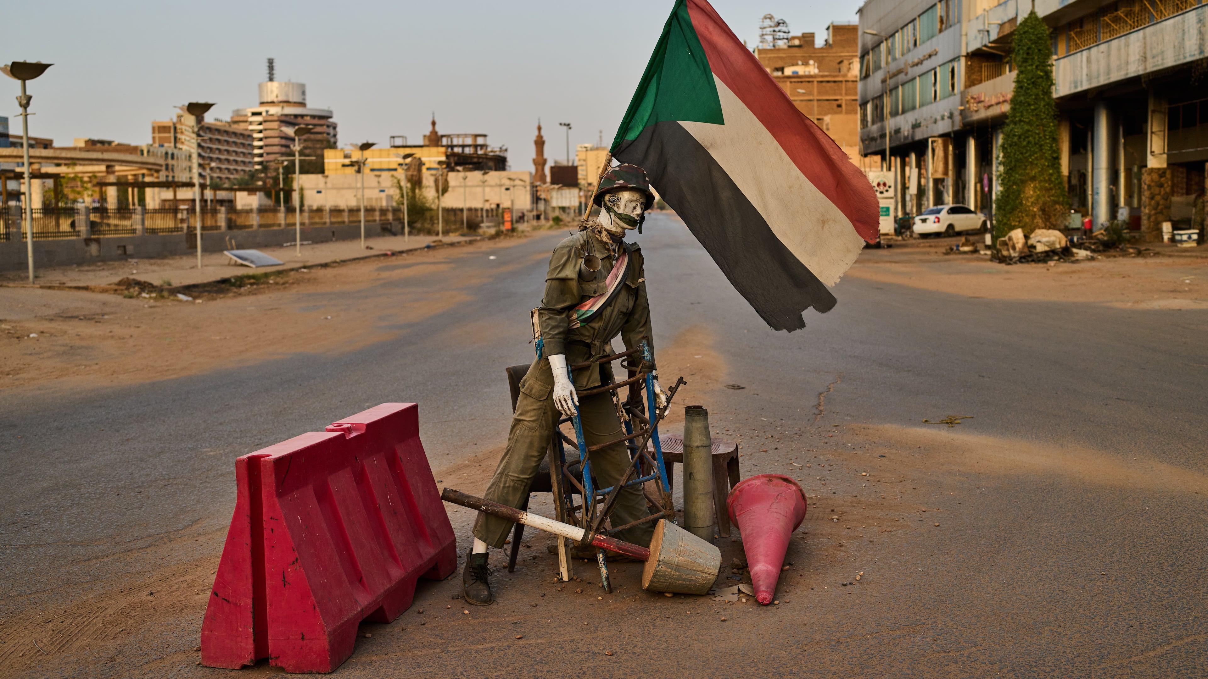 An empty checkpoint where a mannequin dressed as a soldier stands in downtown Khartoum, Sudan, Sunday, April 19, 2026. (AP Photo/Bernat Armangue)