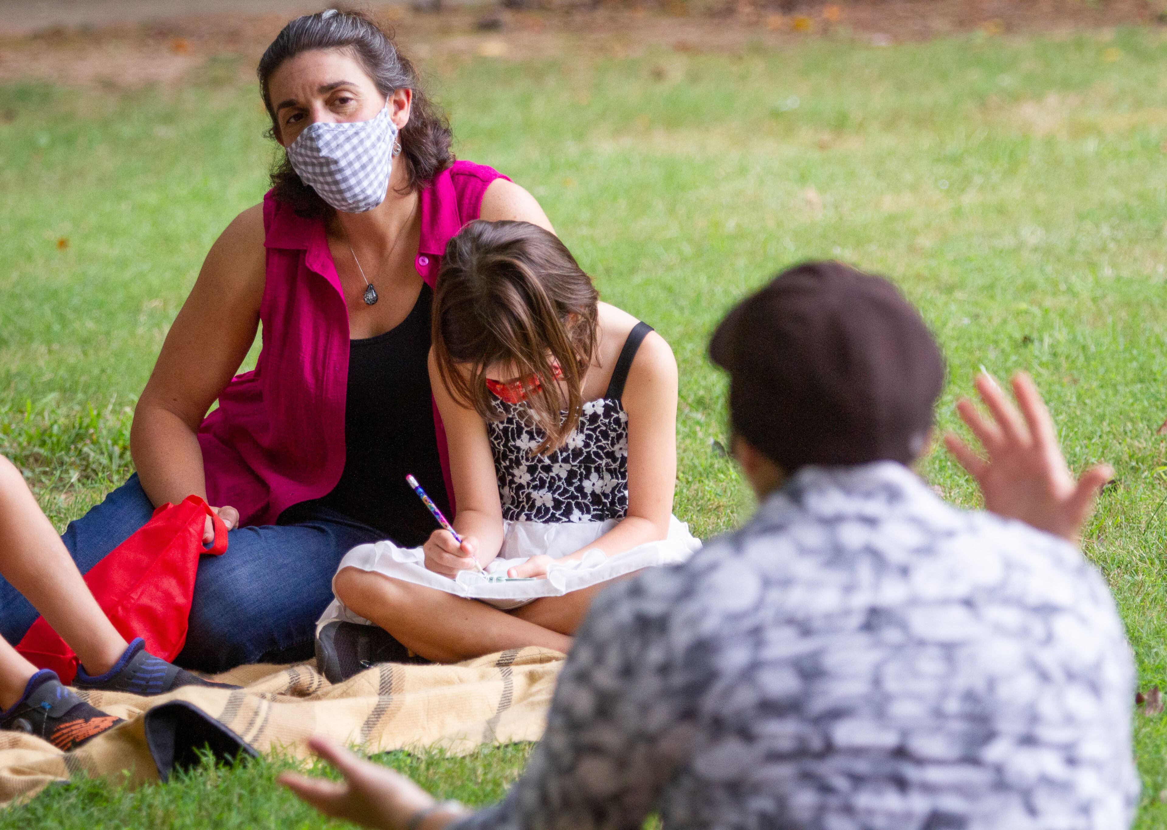 Robin Edwards and her daughter Natalie Nava Senior tells a story during a Limmud Chavruta activity at Mason Mill Park in Atlanta, on September 13, 2020. At the Chavruta station, participants talk about the importance of relationships and connections and reflect on what can be done to strengthen them. STEVE SCHAEFER / SPECIAL TO THE AJC