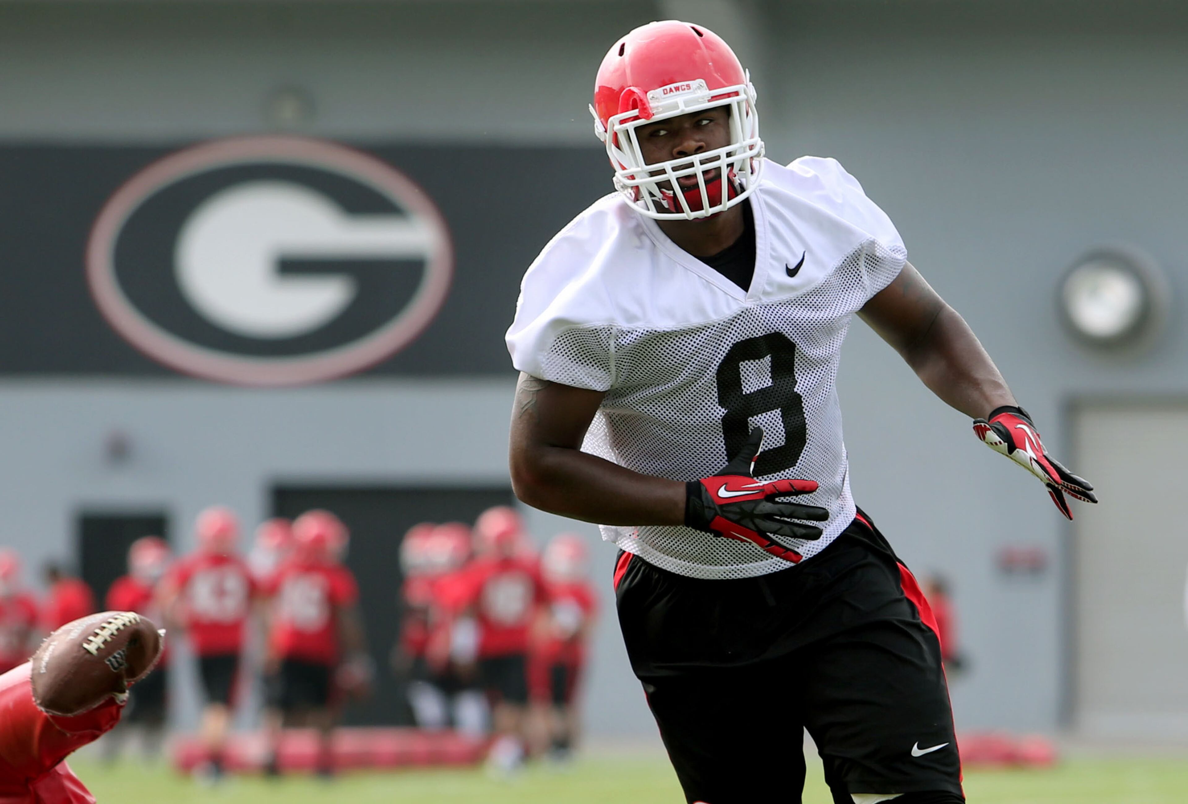University of Georgia linebacker Shaun McGee (8) participates in a drill during preseason practice at the University of Georgia Tuesday afternoon in Athens, Ga., August 6, 2013. McGee is a freshman from Brookwood High School in Snellville, Ga.. JASON GETZ / JGETZ@AJC.COM