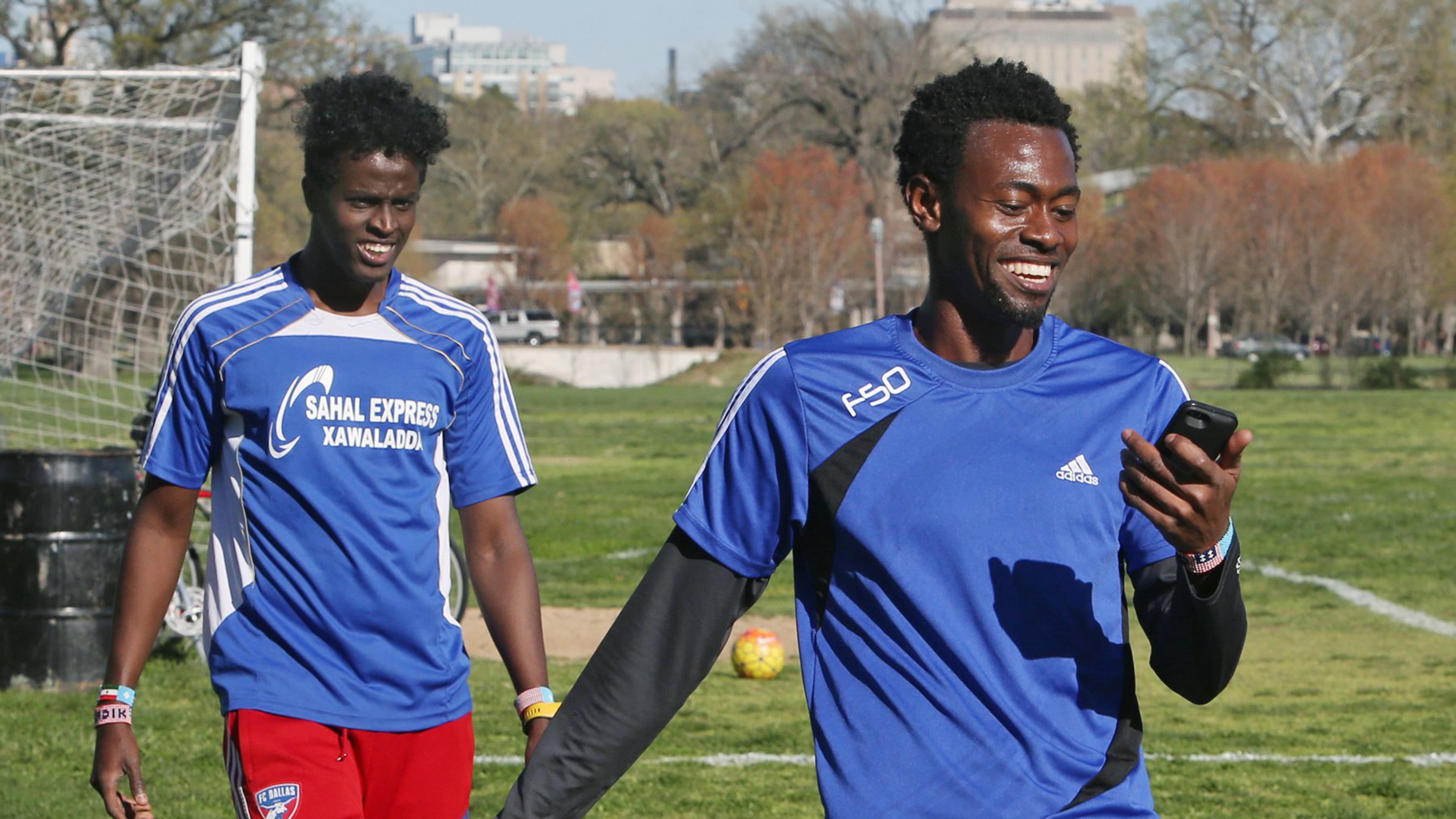 Saadiq Mohammed, left, and Sa'ad Hussein check their sprint times in Forest Park on April 7, 2016, in St. Louis during a soccer practice as they try to get back into shape so they can compete on teams in St. Louis. (J.B. Forbes/St. Louis Post-Dispatch/TNS)