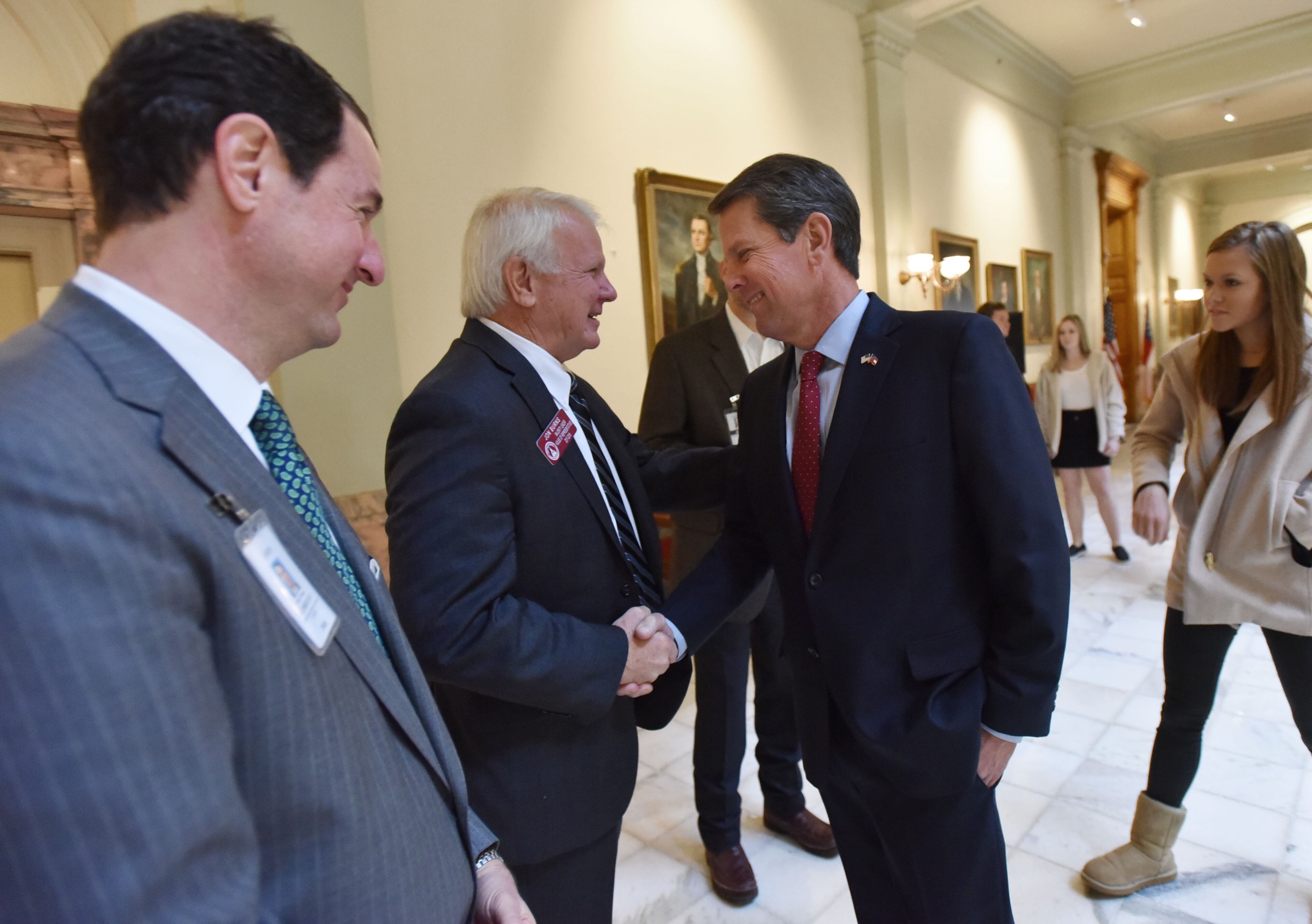 November 17, 2018 Atlanta - Brian Kemp is greeted by State House Majority Leader Jon Burns and other officials as he walks in before a press conference at The Georgia State Capitol the day after Stacey Abrams ended her campaign on Saturday, November 17, 2018. HYOSUB SHIN / HSHIN@AJC.COM