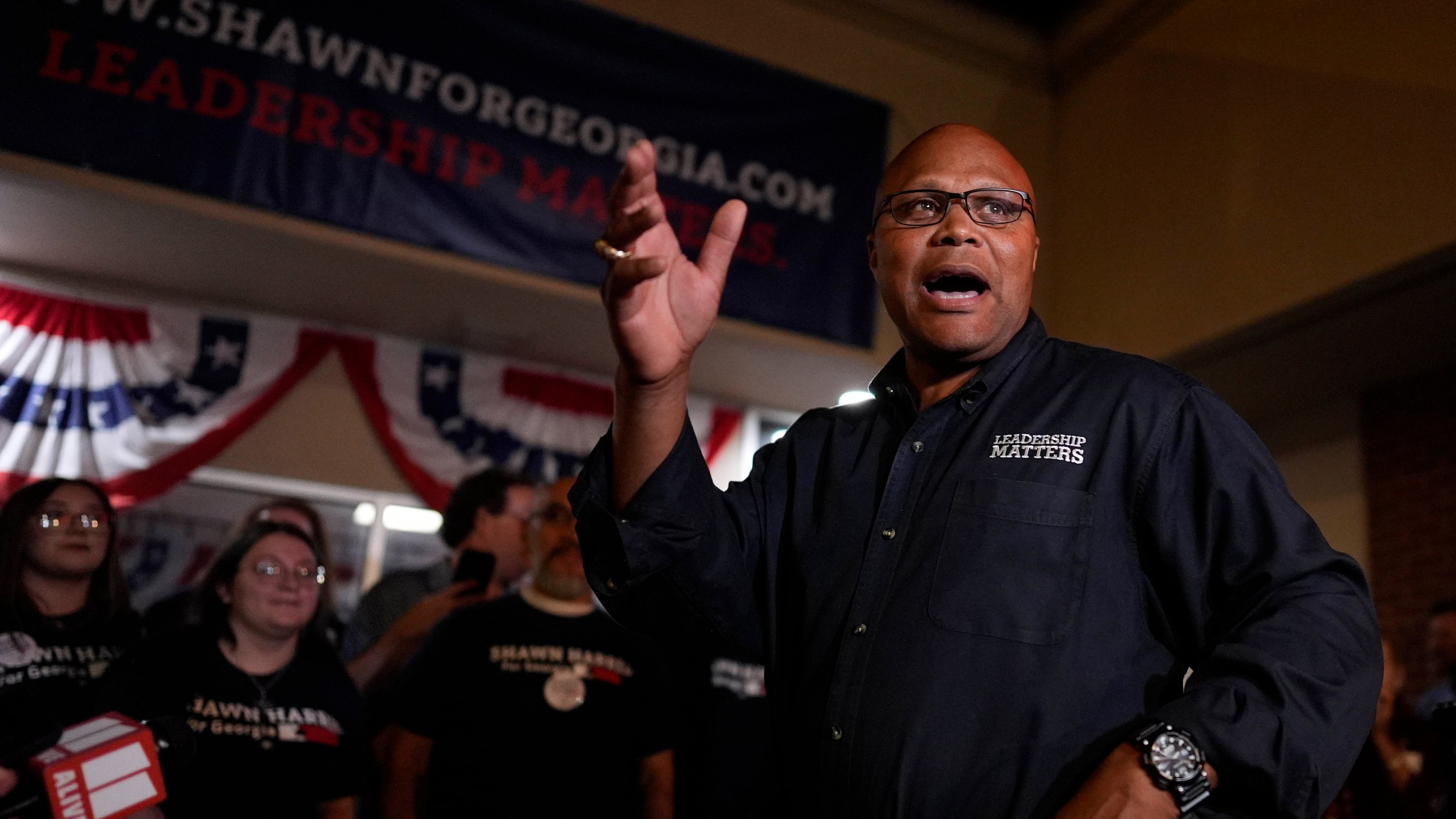 Democrat Shawn Harris speaks to supporters after learning he would advance to a runoff election against Republican Clay Fuller during an election night watch party, Tuesday, March 10, 2026, in Rome, Ga. (AP Photo/Mike Stewart)