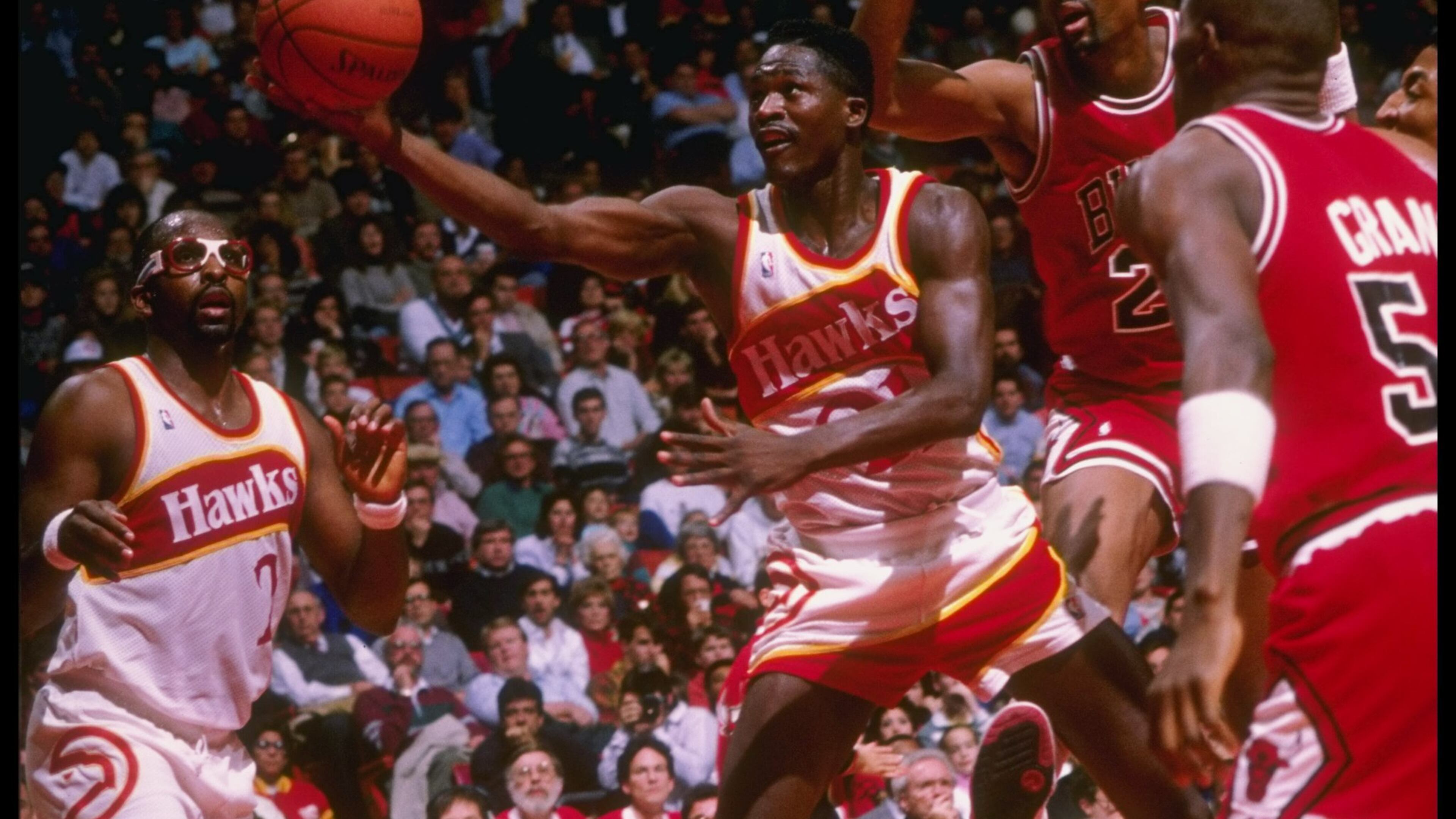 In his first season with Atlanta, Moses Malone (left) teamed up with Dominique Wilkins and the center averaged 20.2 points per game.