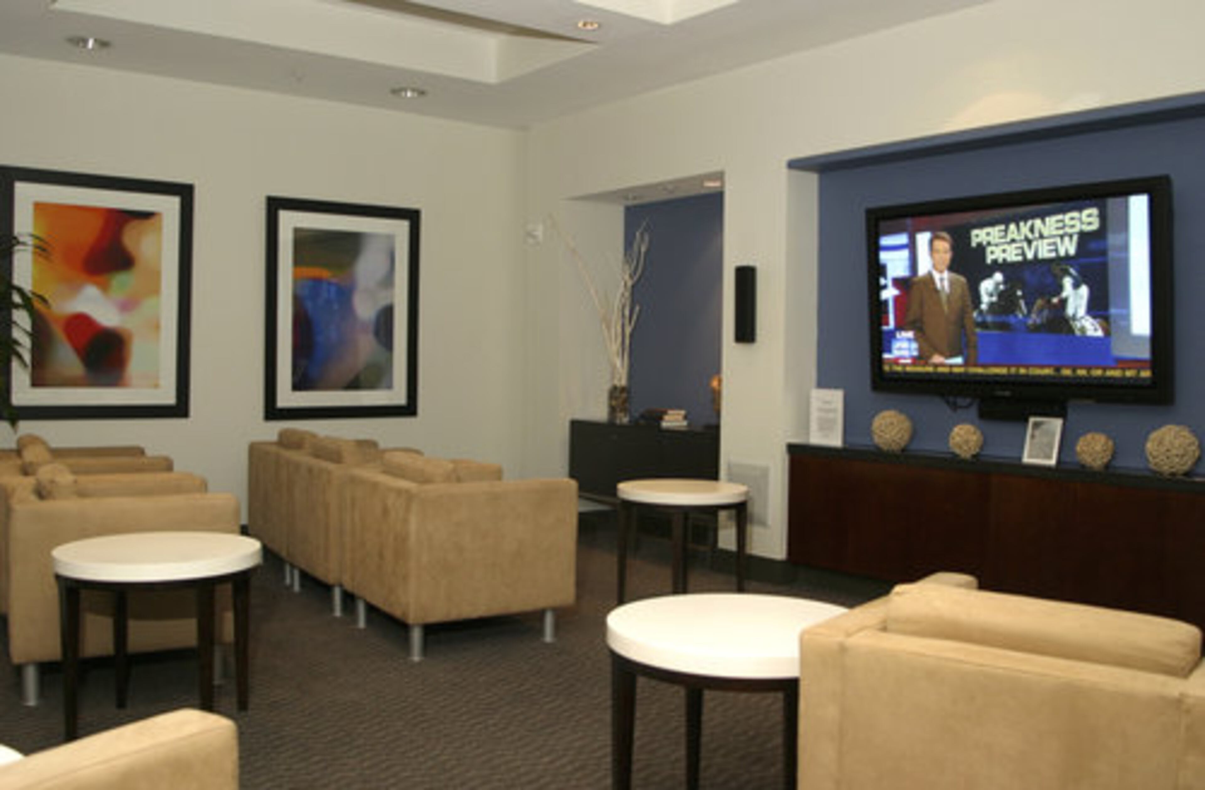 "When talking about some benefits of the building, MARTA is actually right downstairs. So that makes it really convenient to travel around especially to the airport - it's door-to-door service," says Miranda. Pictured is the media room for the residences at Twelve at Centennial Park.