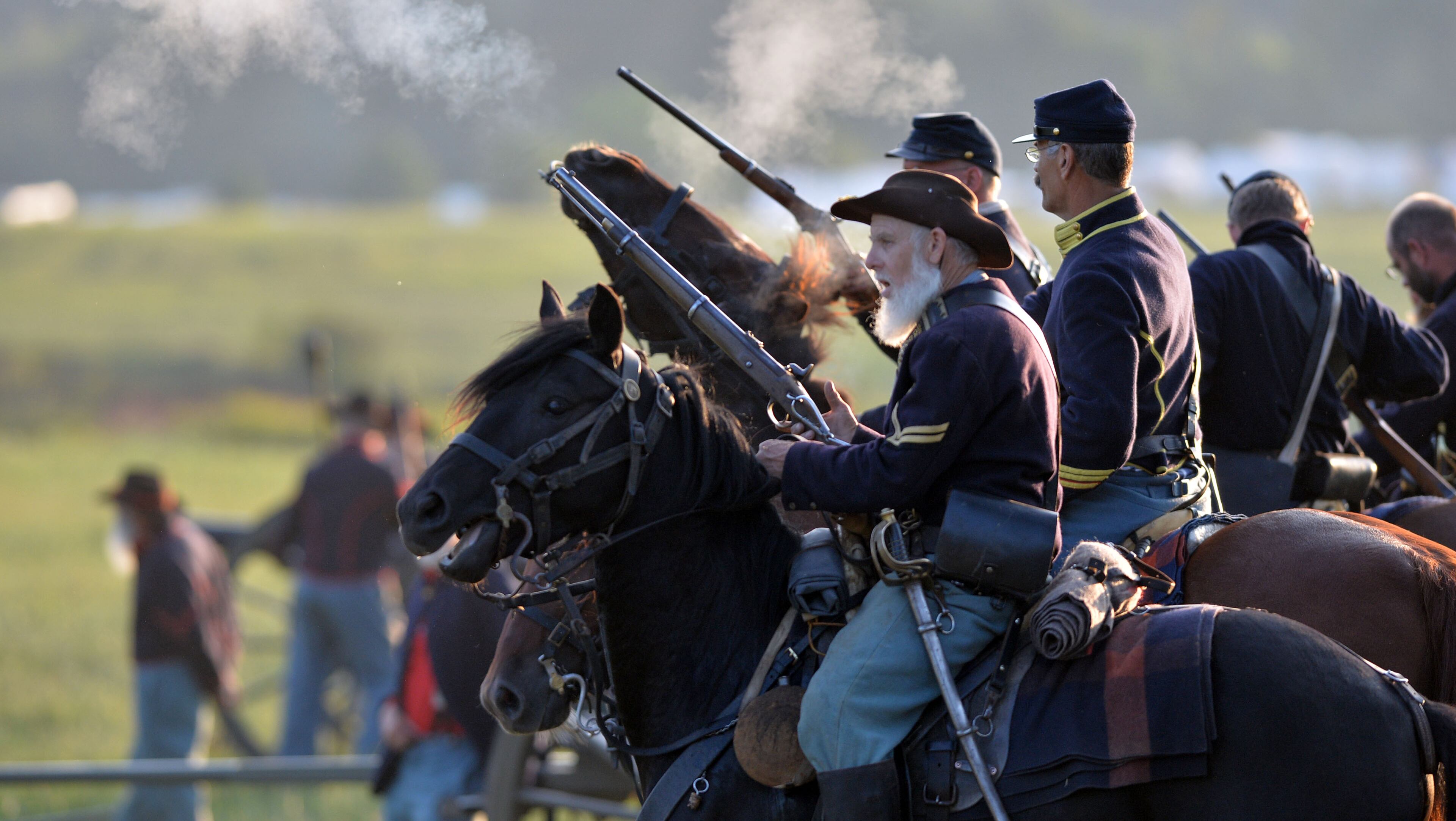 Union cavalry awaits deployment. Confederate and Union reenactors recreate the Battle of Utoy Creek during the Atlanta Campaign's Battle of Atlanta re-enactment at the Nash Farm Battlefield Friday, September 19, 2014. Thousands of re-enactors and spectators are expected to descend on Nash Farm Battlefield for this weekend's Battle of Atlanta events starting Friday and ending Sunday afternoon. Kilpatrick's Raid, the Battle of Cheatham's Hill, and Battle of Atlanta will be reenacted Saturday and Sunday. Confederate and Federal troops are in separate encampments about a 1/2 mile apart at the site. KENT D. JOHNSON / KDJOHNSON@AJC.COM