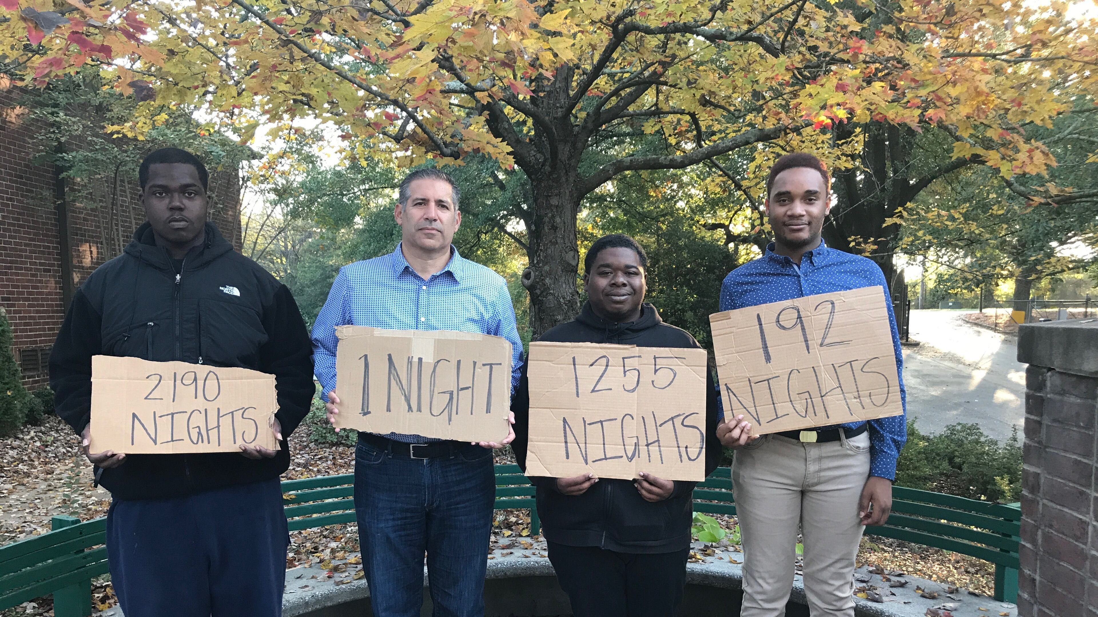 Ben Deutsch with youth involved in Covenant House Georgia's programs. They're holding signs showing how long they were homeless.
