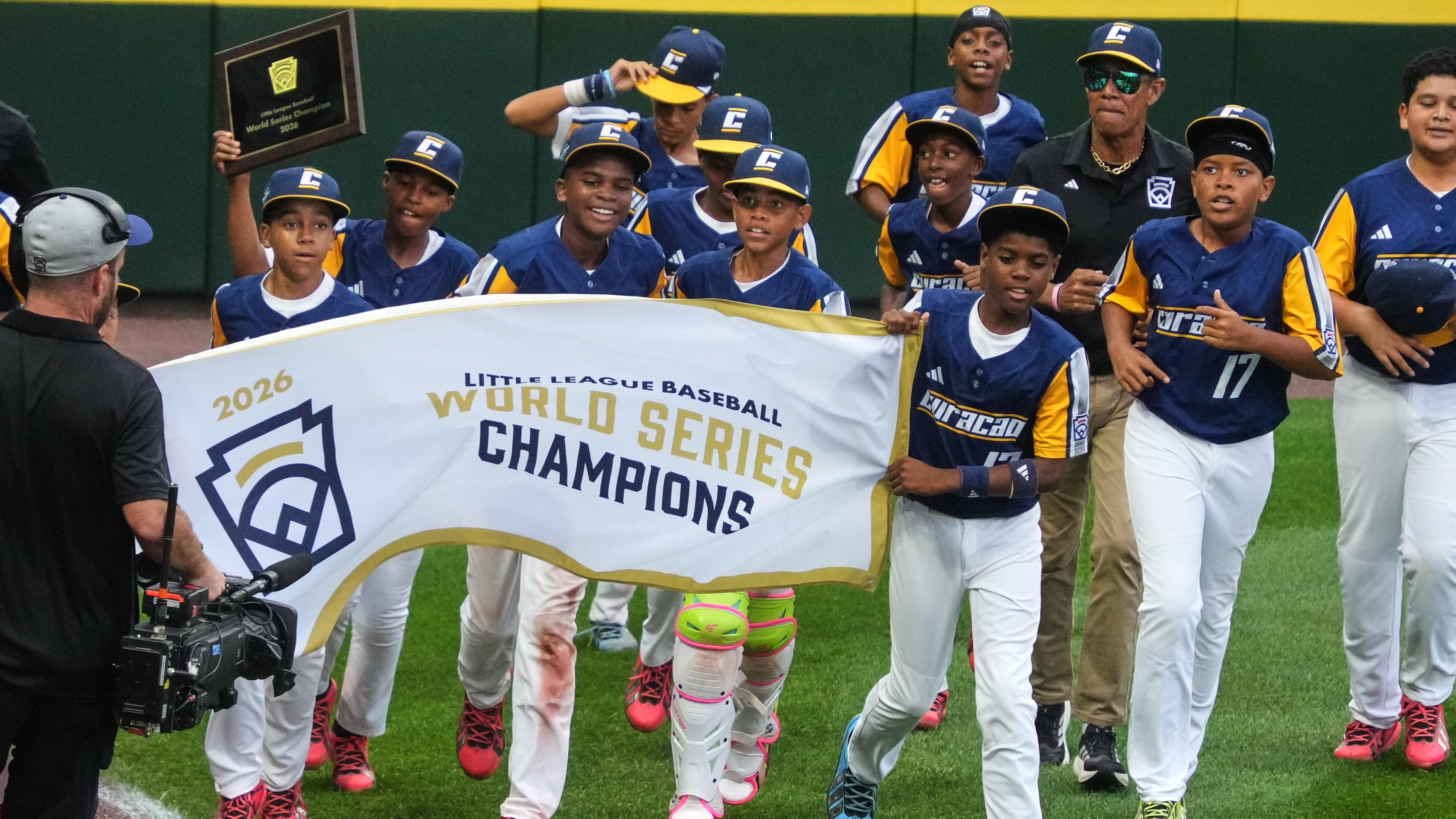 Curacao takes a victory lap after winning the Little League World Series Championship baseball game against Henderson, Nev., in South Williamsport, Pa., Sunday, Aug. 30, 2026. (AP Photo/Gene J. Puskar)