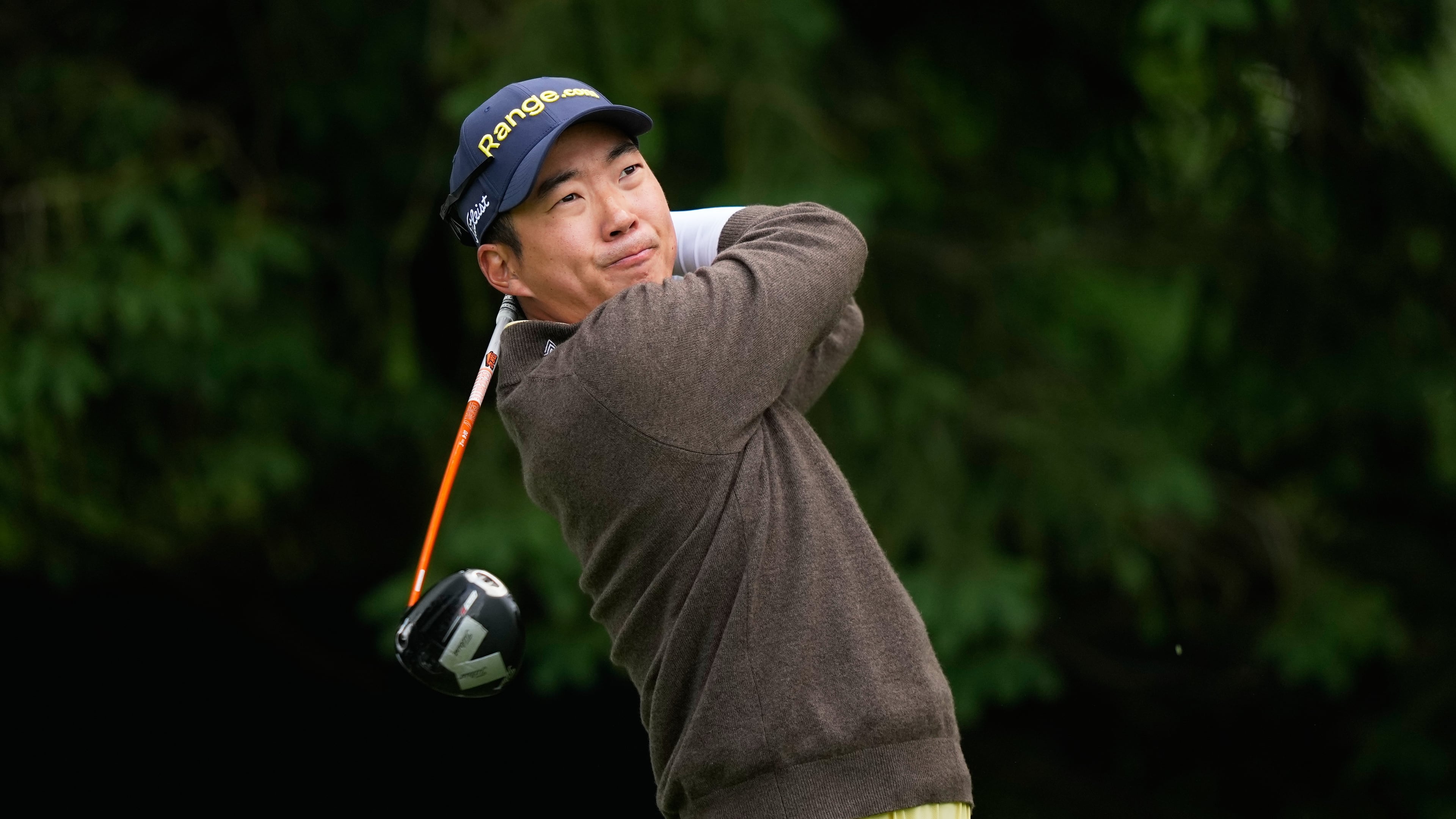 Michael Kim, of South Korea, watches his tee shot on the fourth hole during the first round of the PGA Championship golf tournament practice round at Aronimink Golf Club, Thursday, May 14, 2026, in Newtown Square, PA. (AP Photo/Matt Slocum)